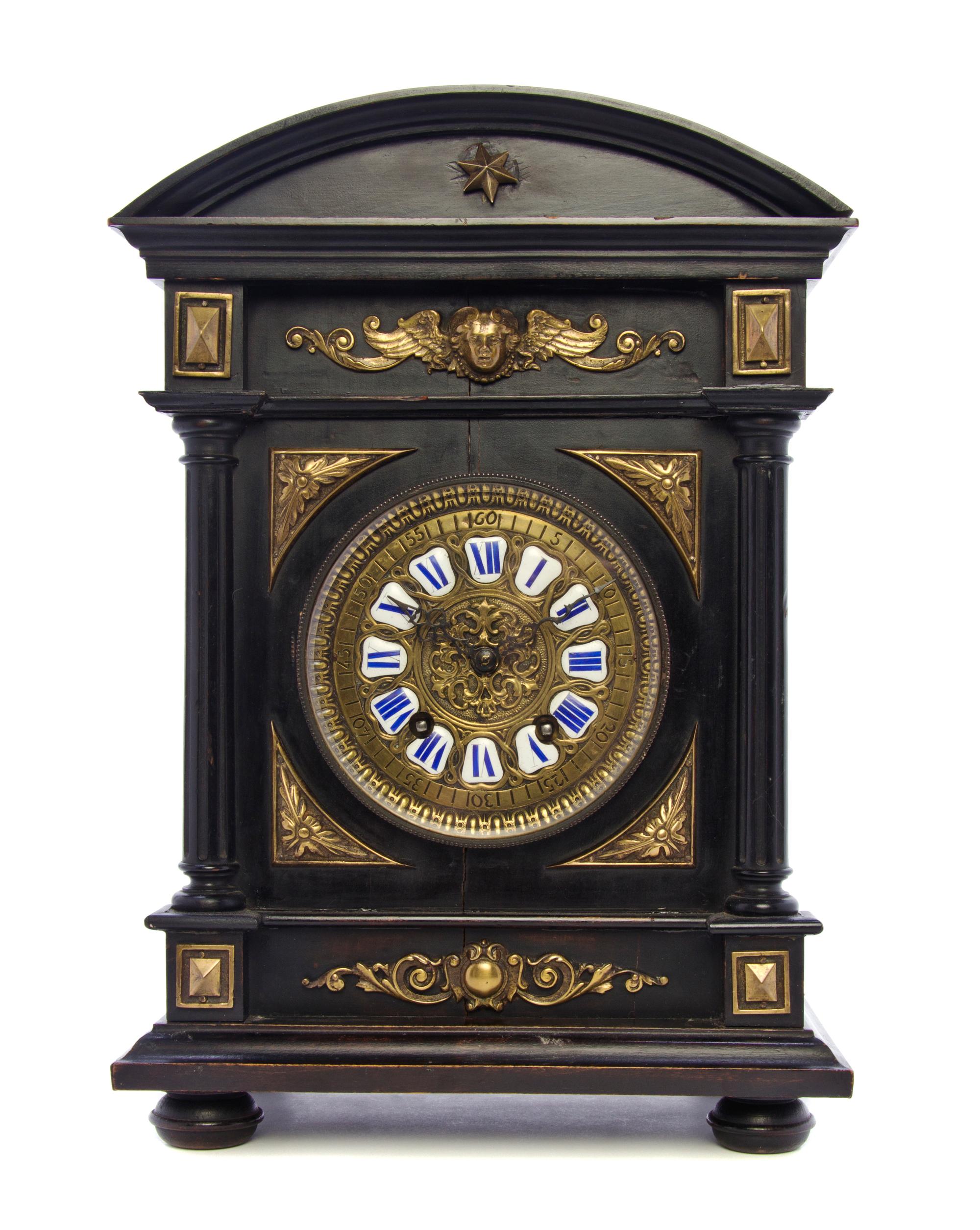 A German Neoclassical Ebonized and Bronze Mounted Mantel Clock, Lenzkirch, Height 14 3/4 inches.