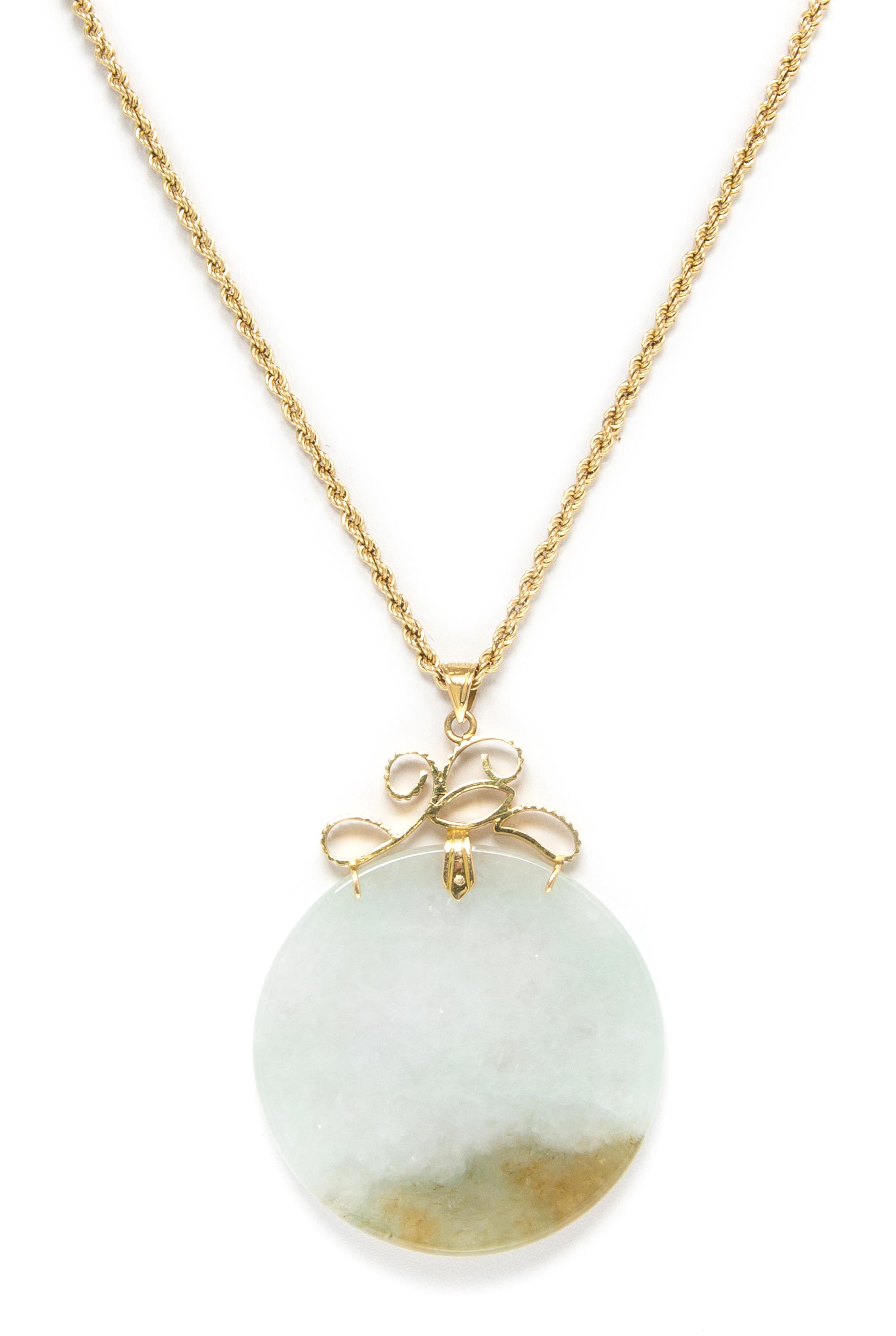 A 14 Karat Yellow Gold and Jade Pendant Necklace, 19.70 dwts.