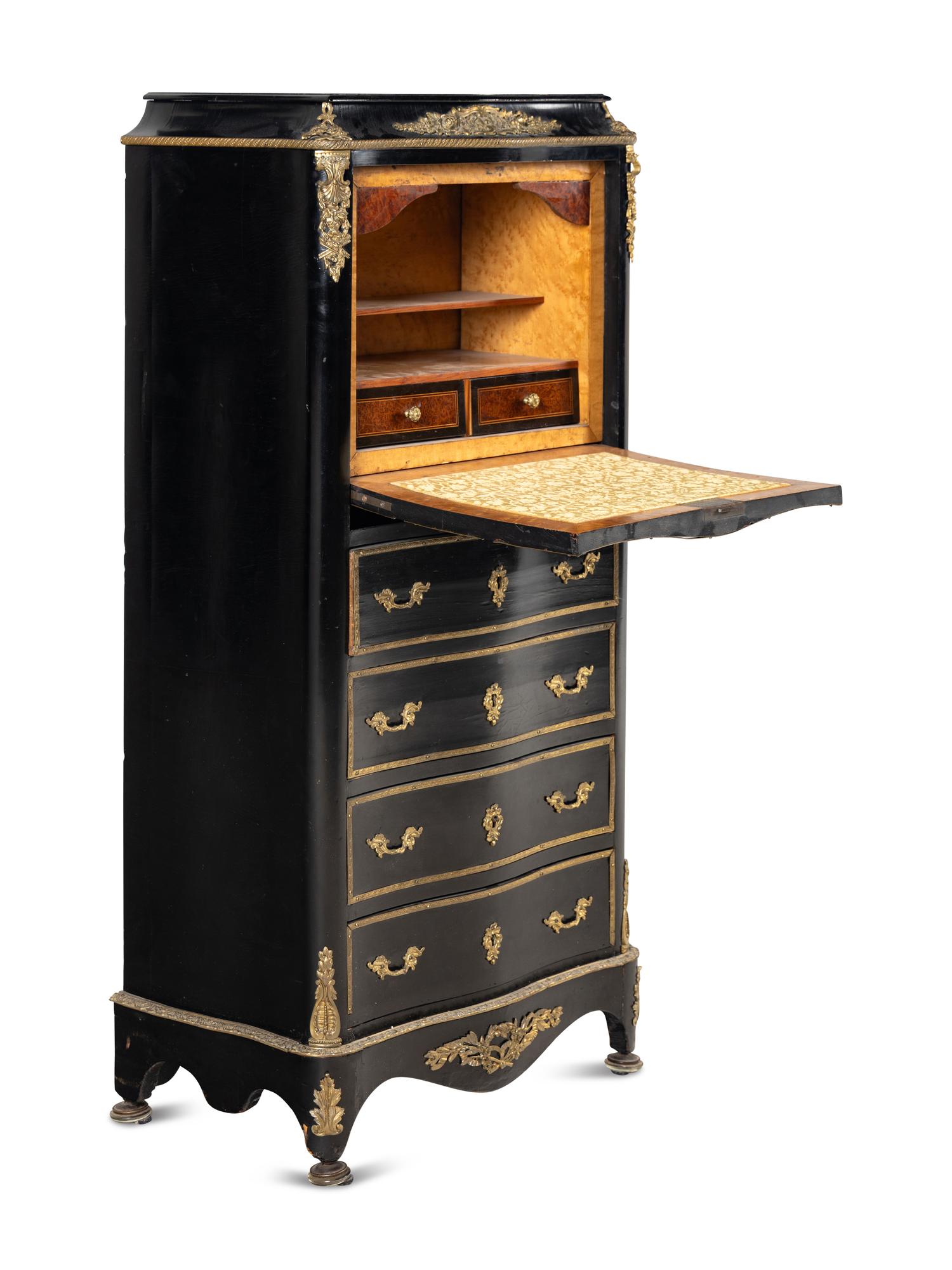 A Napoleon III Style Gilt Bronze Mounted Ebonized Semainier