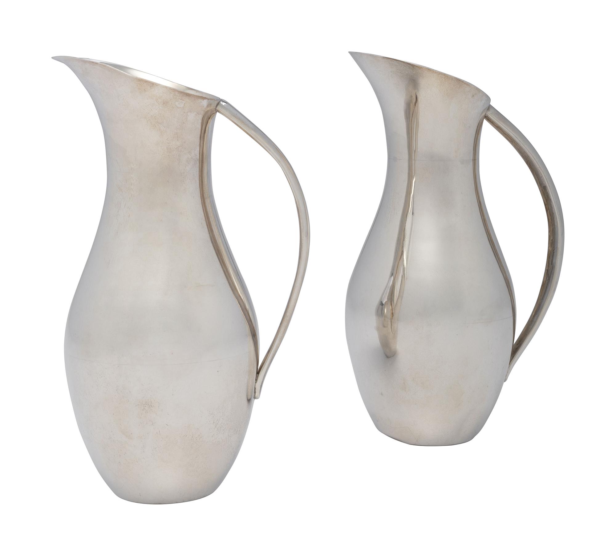 A Pair of Mexican Silver Pitchers