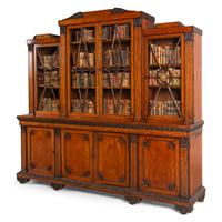 A Regency Mahogany, Ormolu-Mounted and Part Ebonized Breakfront Bookcase