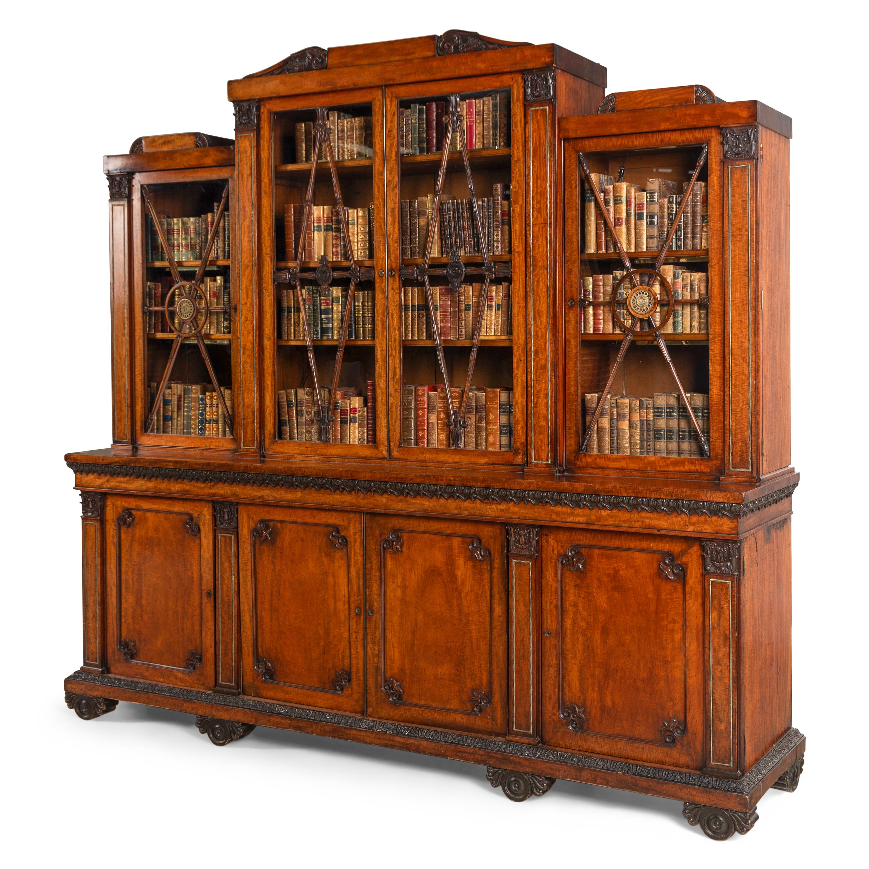 A Regency Mahogany, Ormolu-Mounted and Part Ebonized Breakfront Bookcase