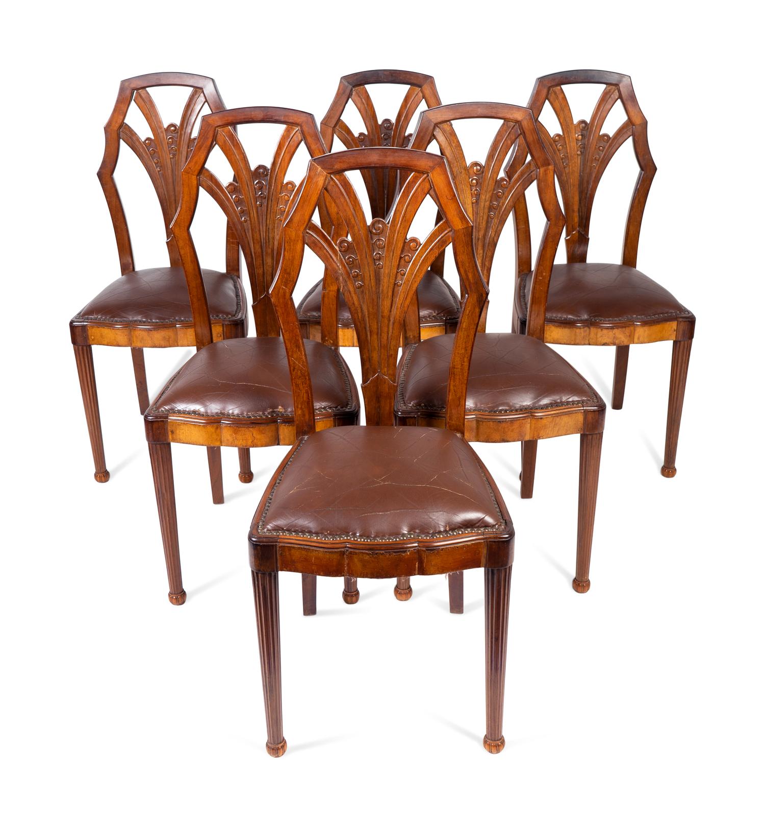A Set of Six Art Deco Carved Walnut Dining Chairs — 20TH CENTURY