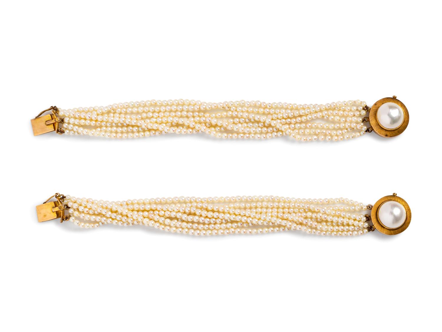 A Pair of 14 Karat Yellow Gold Multistrand Cultured Pearl Bracelets,