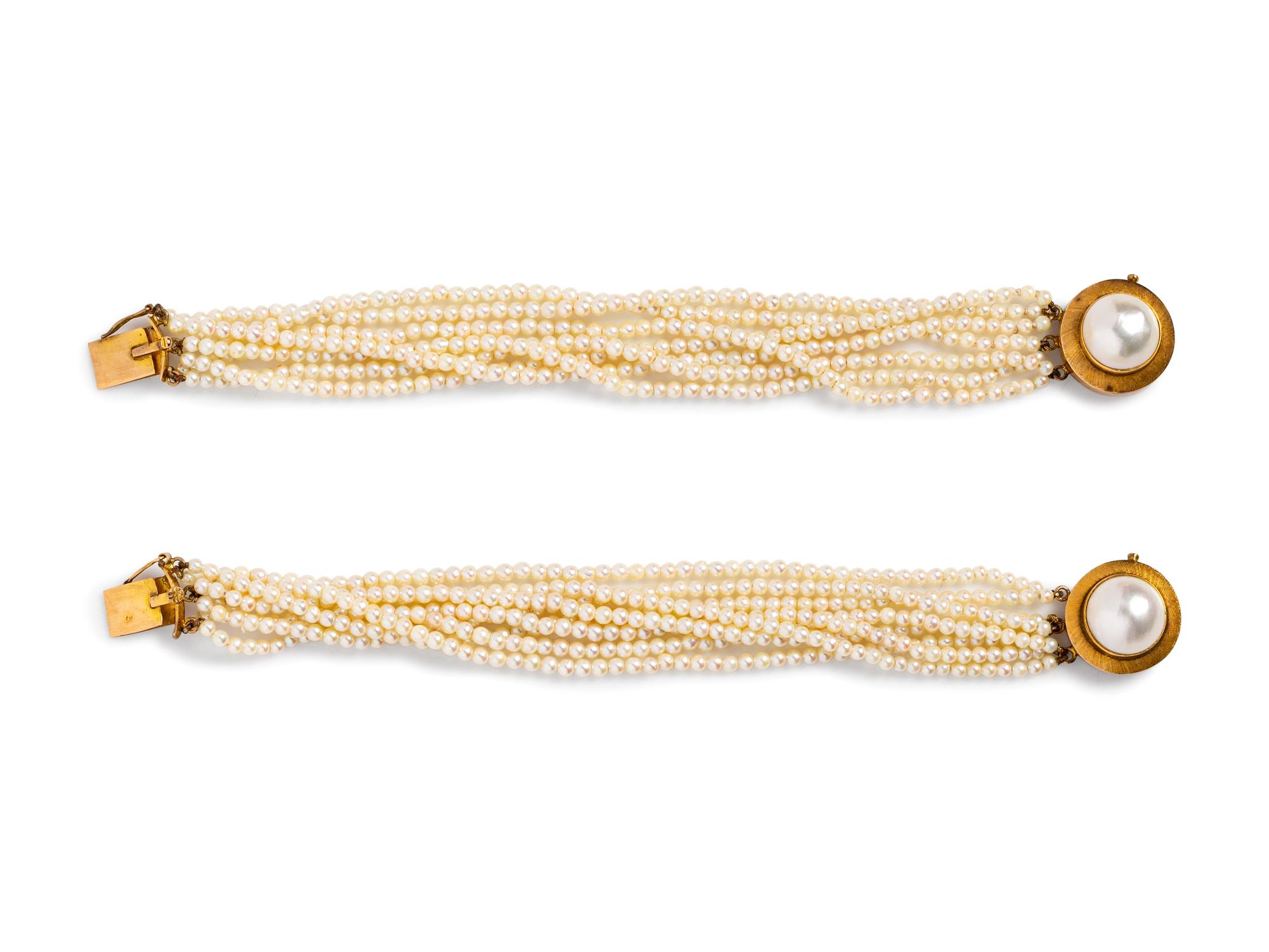 A Pair of 14 Karat Yellow Gold Multistrand Cultured Pearl Bracelets,