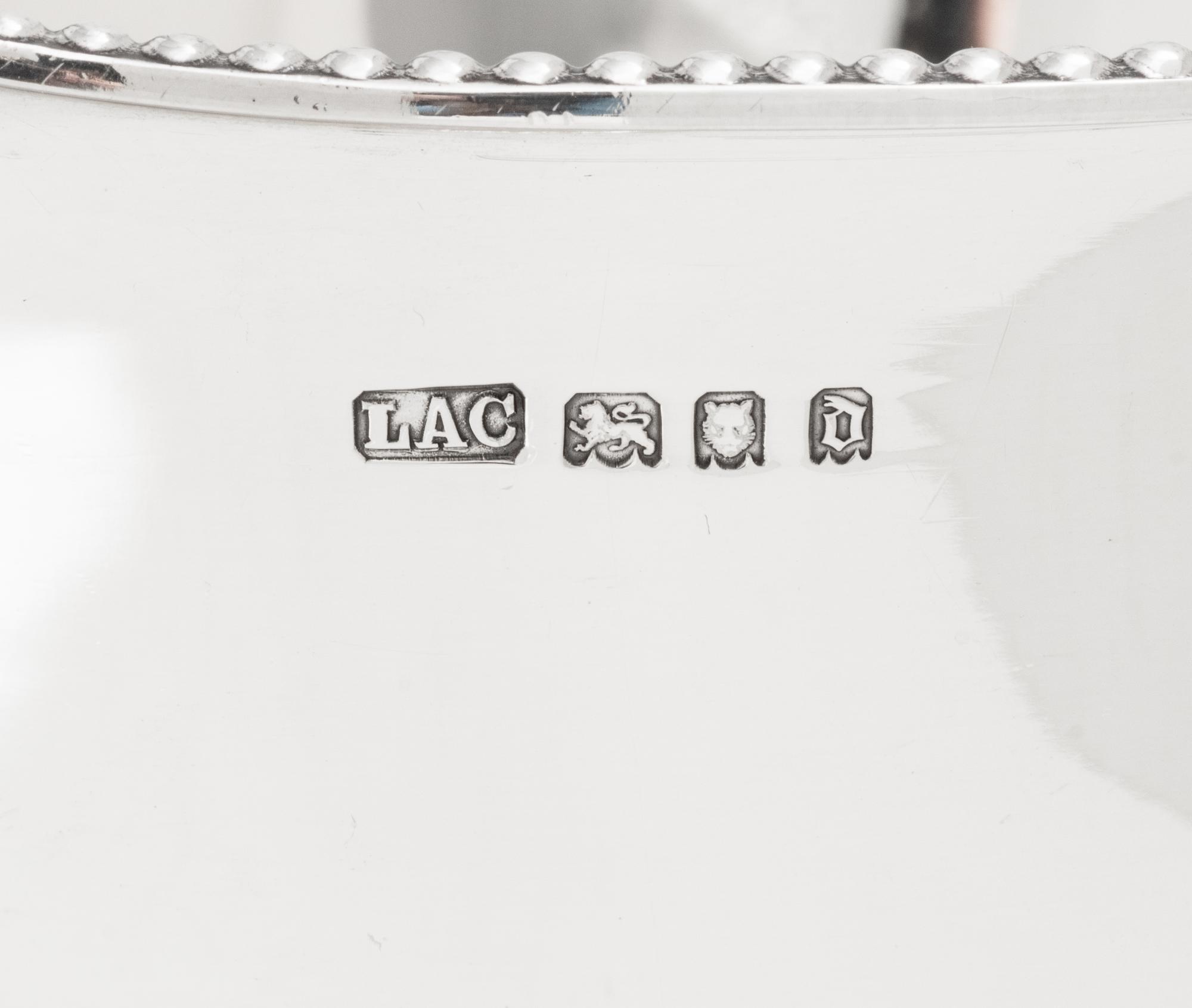 A Pair of English Silver Loving Cups