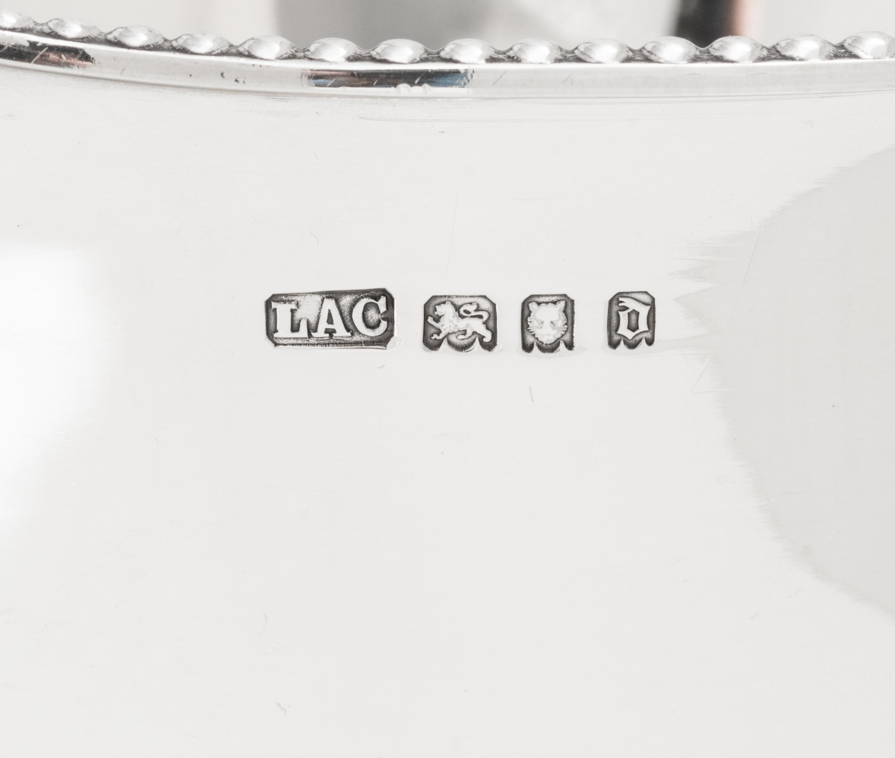 A Pair of English Silver Loving Cups