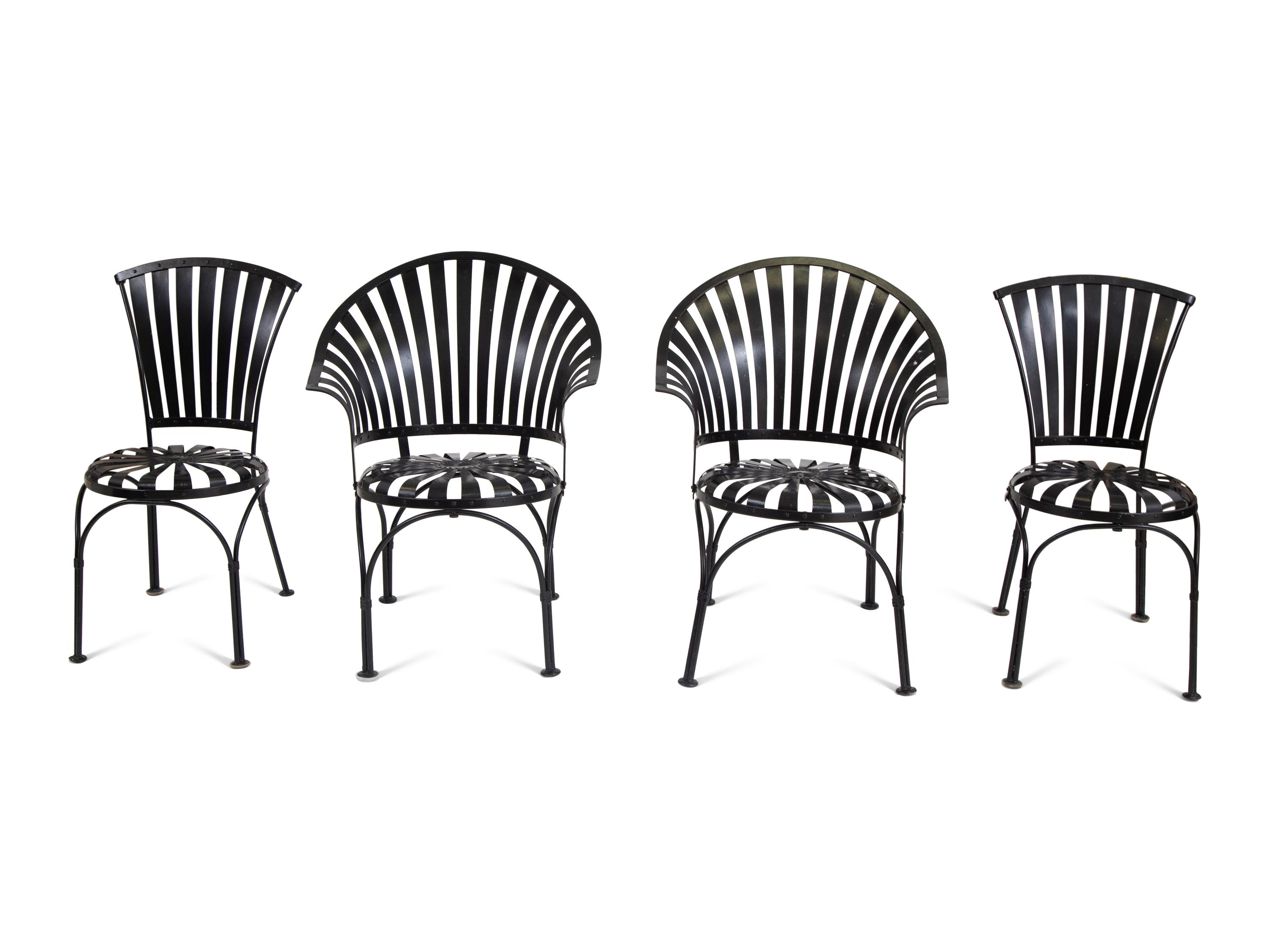A Spring Steel Garden Table and Eight Chairs by Francois Carre