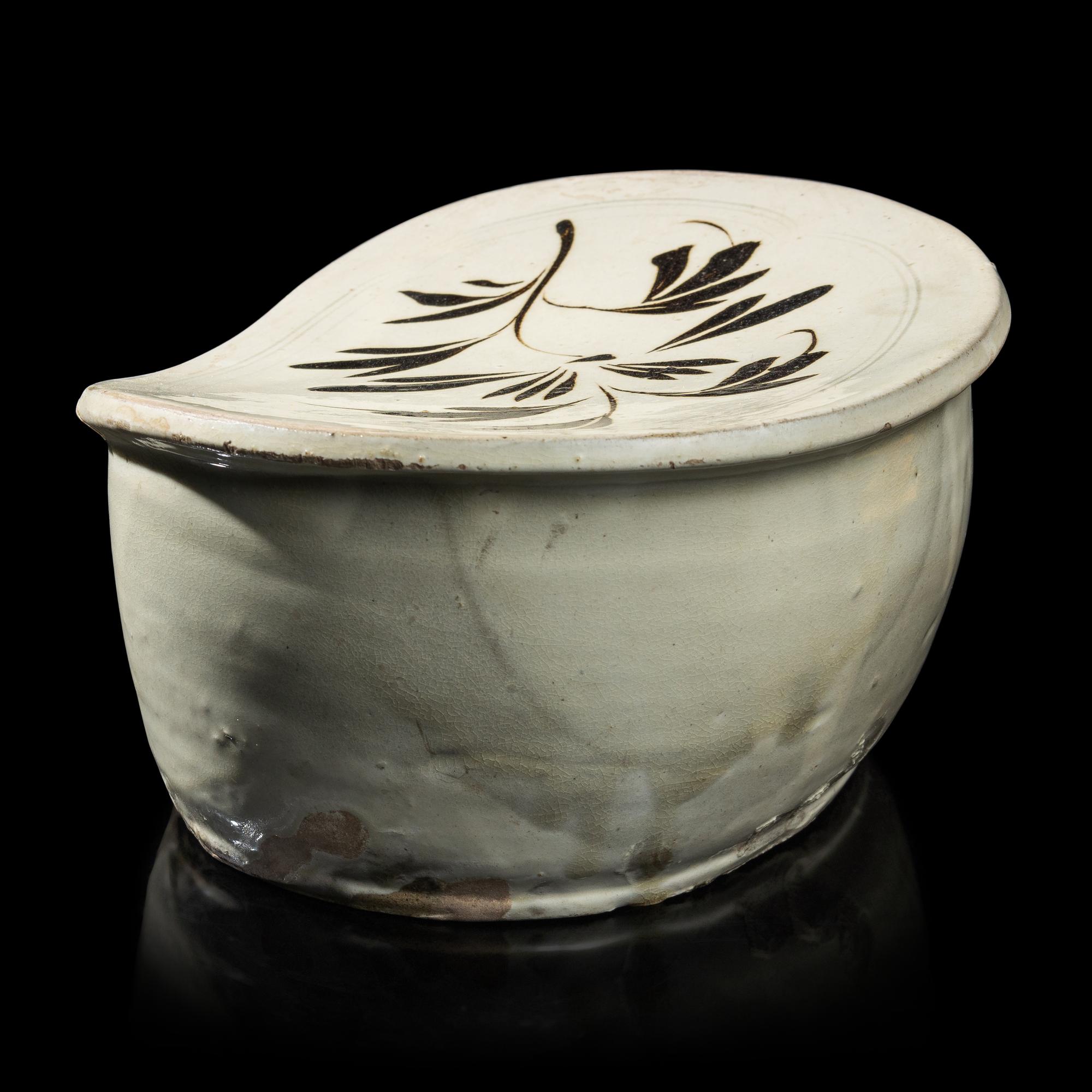 A Chinese Cizhou- Type White Glazed 'Floral' Porcelain Pillow, Yuan Dynasty 元 磁州窯白釉花卉紋枕