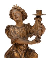 A Pair of Continental Giltwood Figural Altar Candlesticks