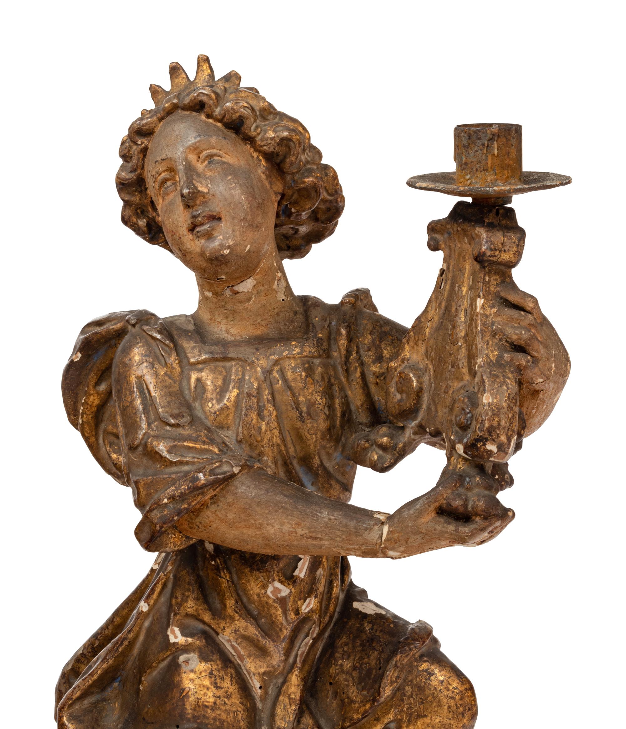 A Pair of Continental Giltwood Figural Altar Candlesticks