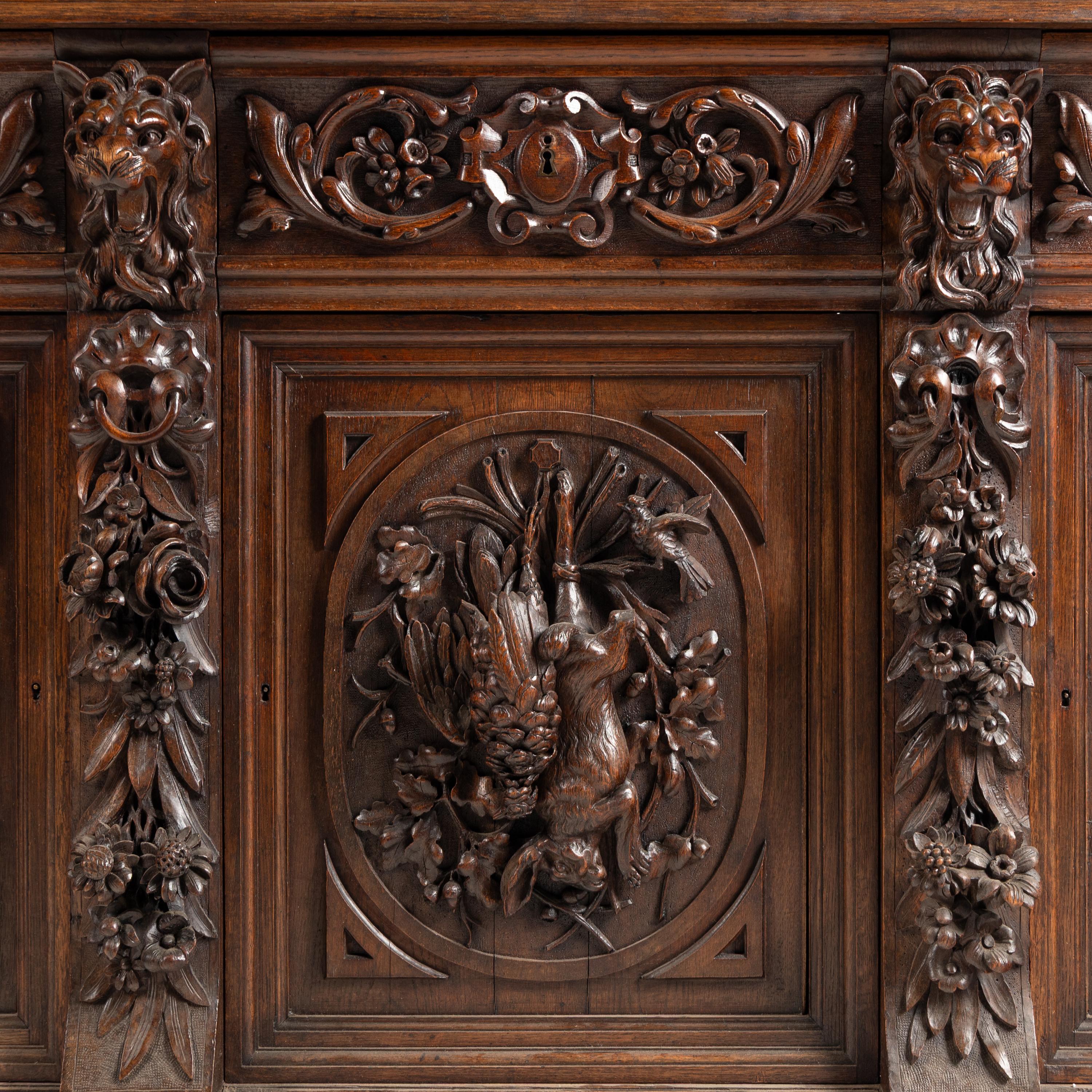 A French Carved Walnut Buffet à Deux Corps