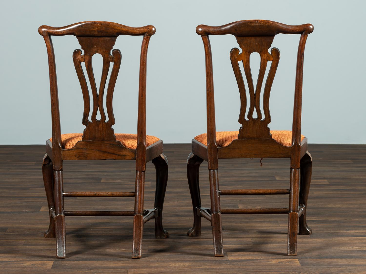 A Set of Six Queen Anne Pierce Carved Mahogany Stretcher Base and Trifid Foot Side Chairs