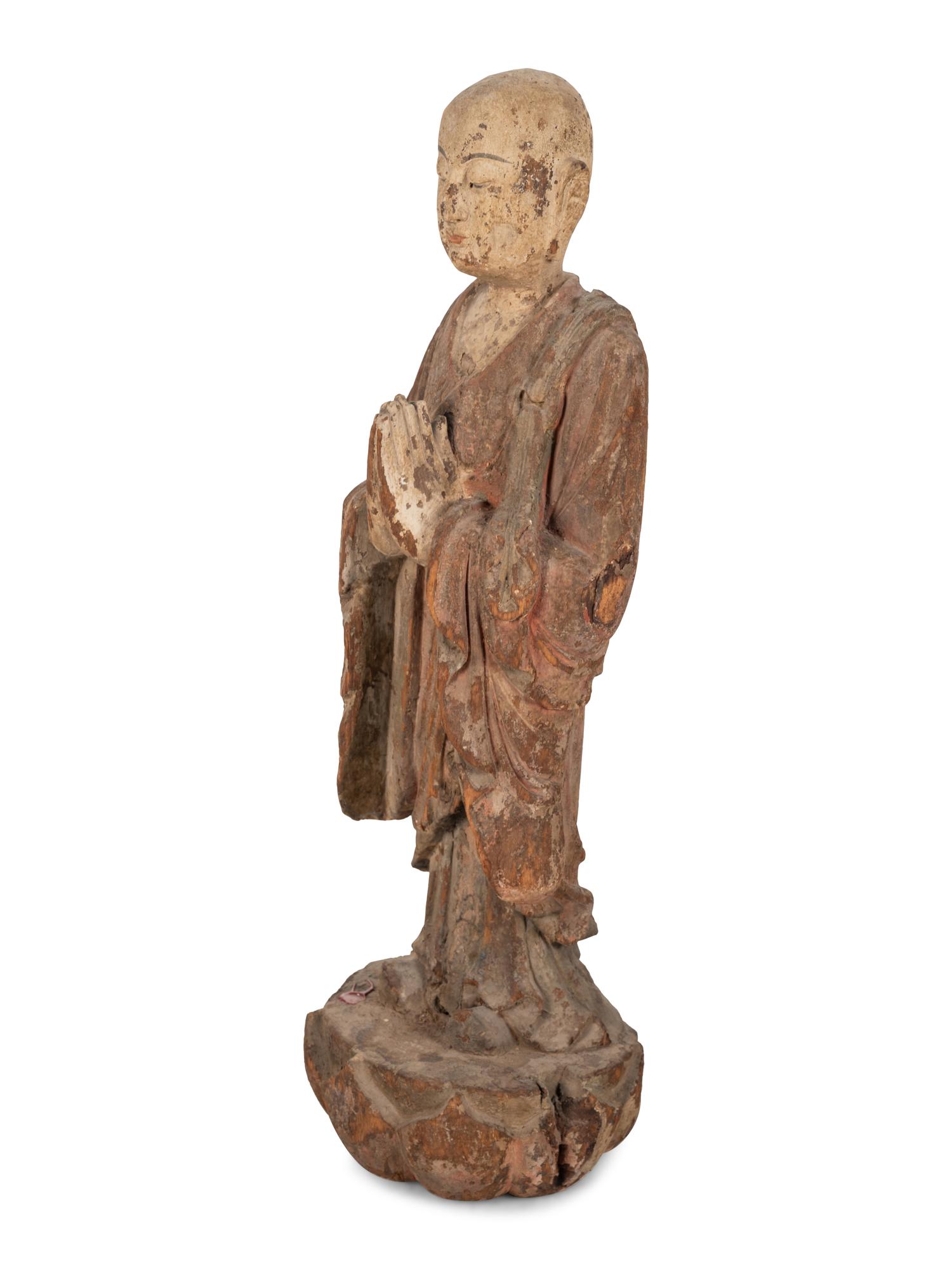 A Chinese Carved Wood Standing Figure with Polychrome Decoration