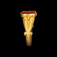 A Migration Period Gold and Spessartine Garnet Ring