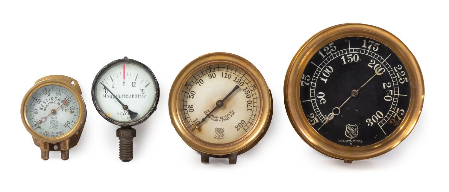 A Group of Four Brass Mounted Railroad Locomotive Pressure Gauges