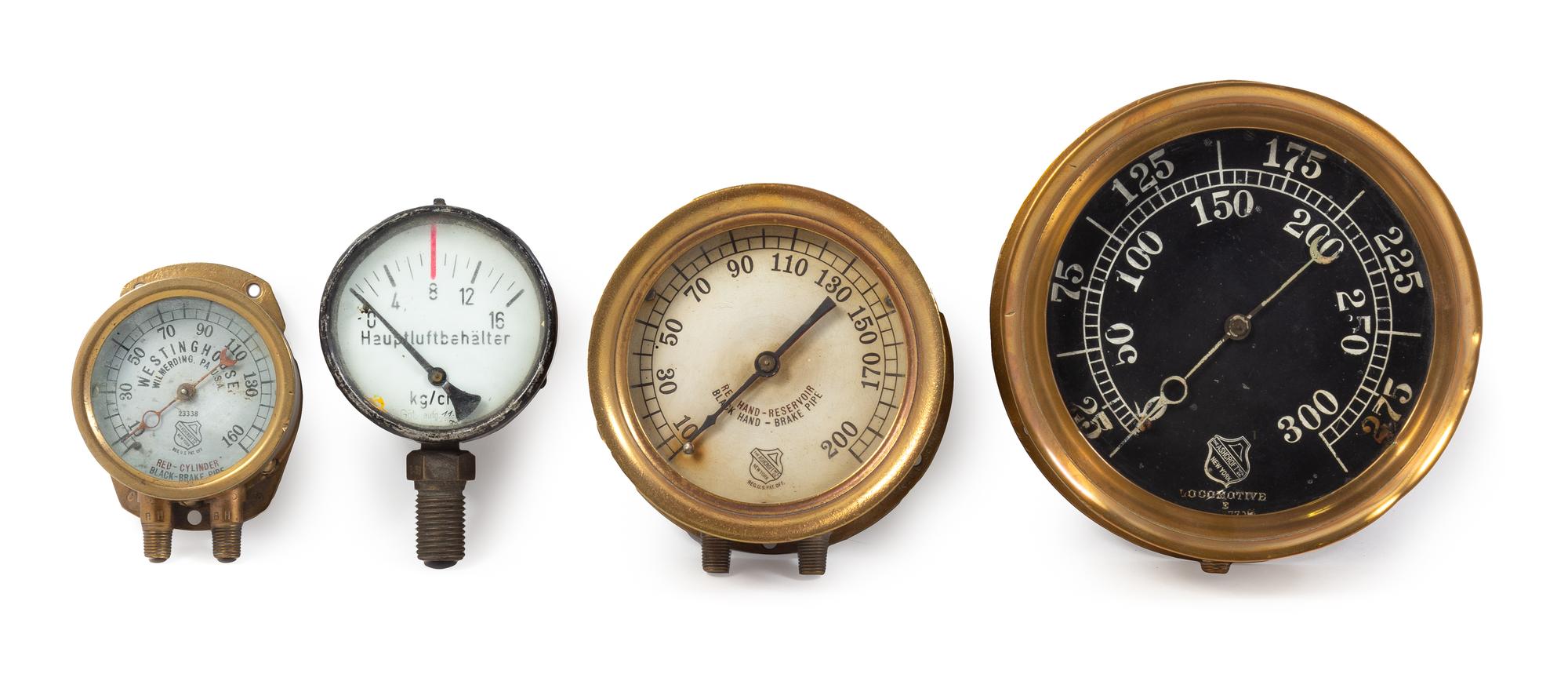 A Group of Four Brass Mounted Railroad Locomotive Pressure Gauges