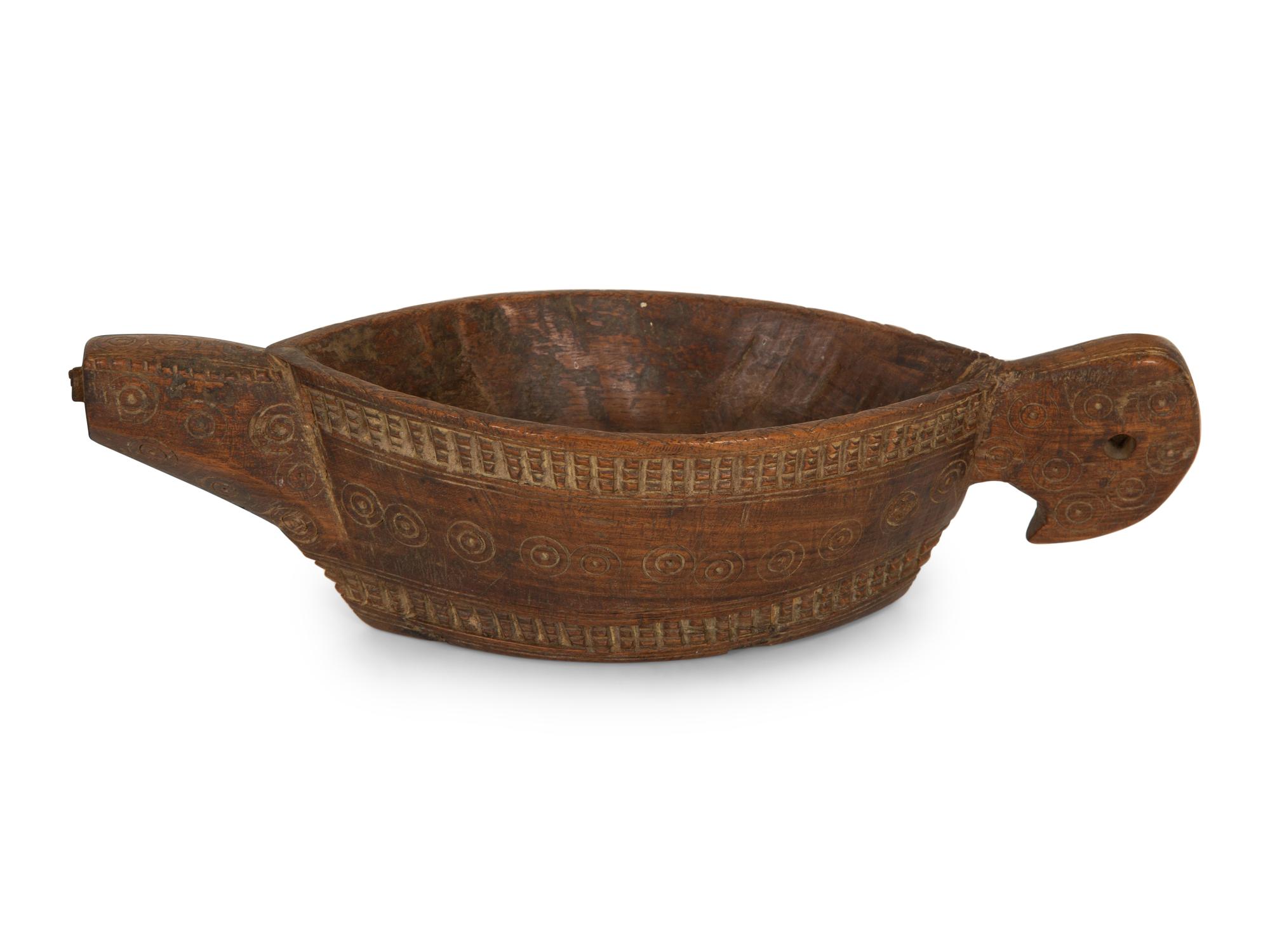 A Mughal Painted Wood Paddle and Two Oceanic Carved Wood Articles
