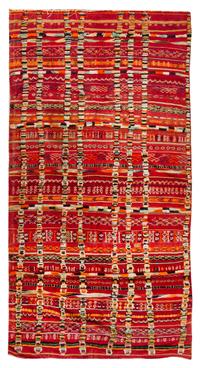 An Afghan Wool Rug 11 feet 1 inch x 5 feet 6 3/4 inches. — 20TH CENTURY