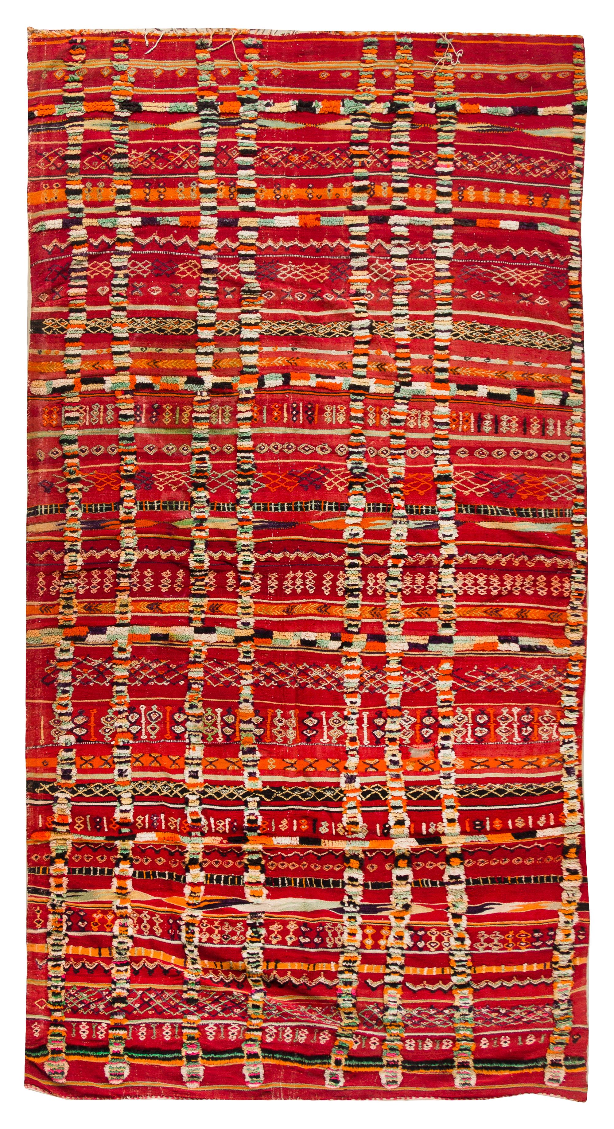 An Afghan Wool Rug 11 feet 1 inch x 5 feet 6 3/4 inches. — 20TH CENTURY