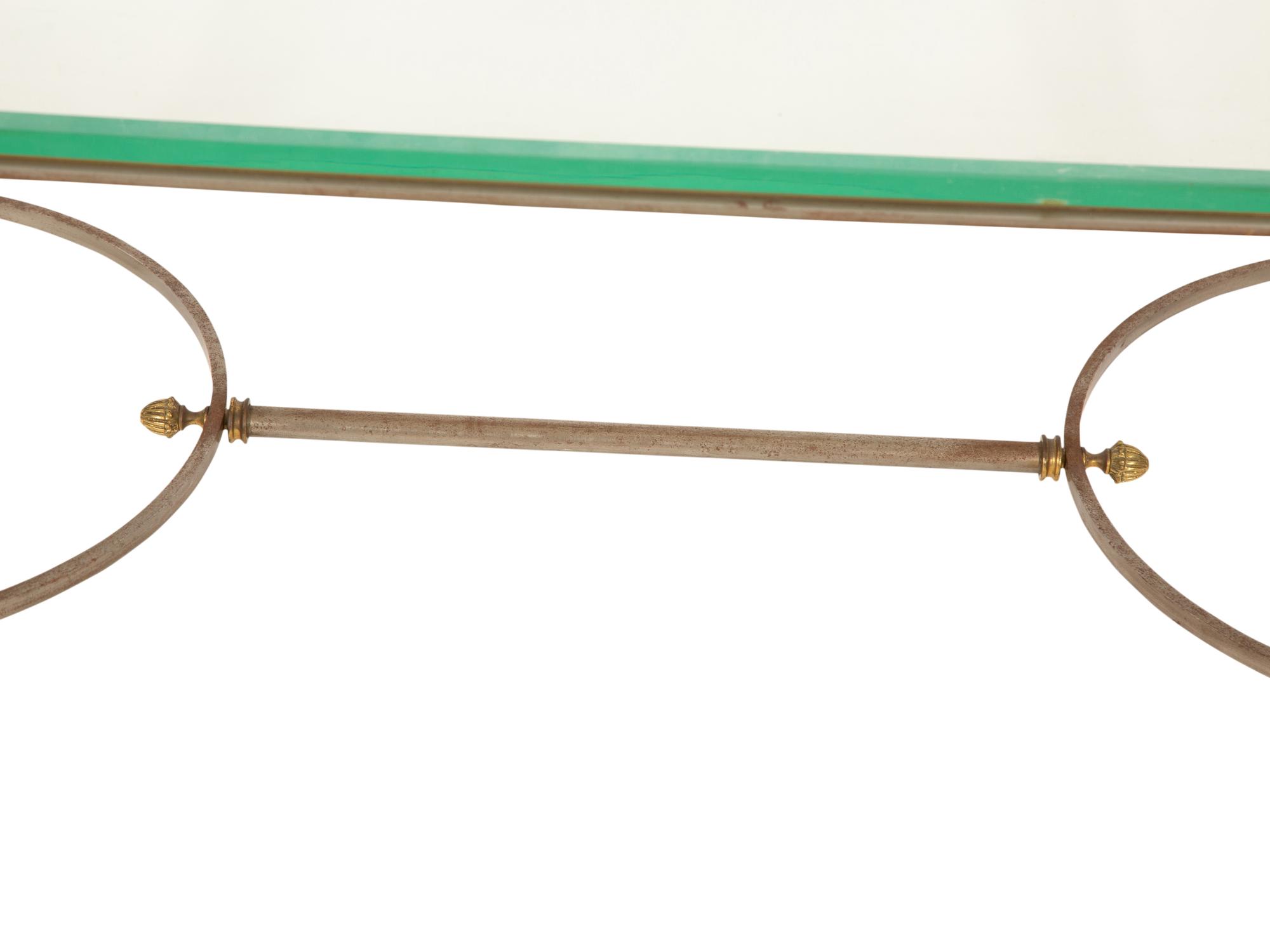 A Neoclassical Style Steel and Brass Glass Top Coffee Table in the Manner of Maison Jansen