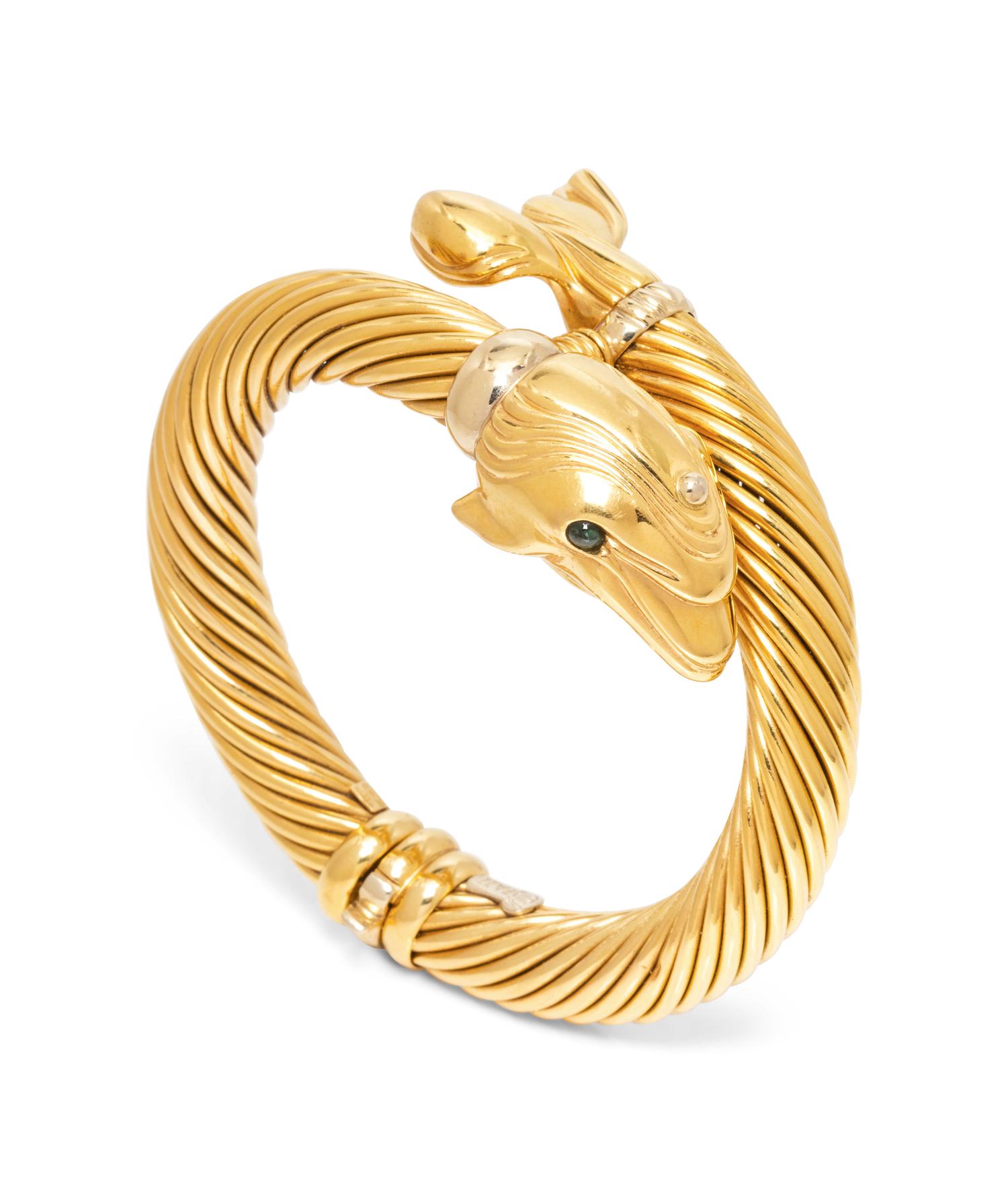 An 18 Karat Yellow Gold Dolphin Motif Bangle Bracelet,