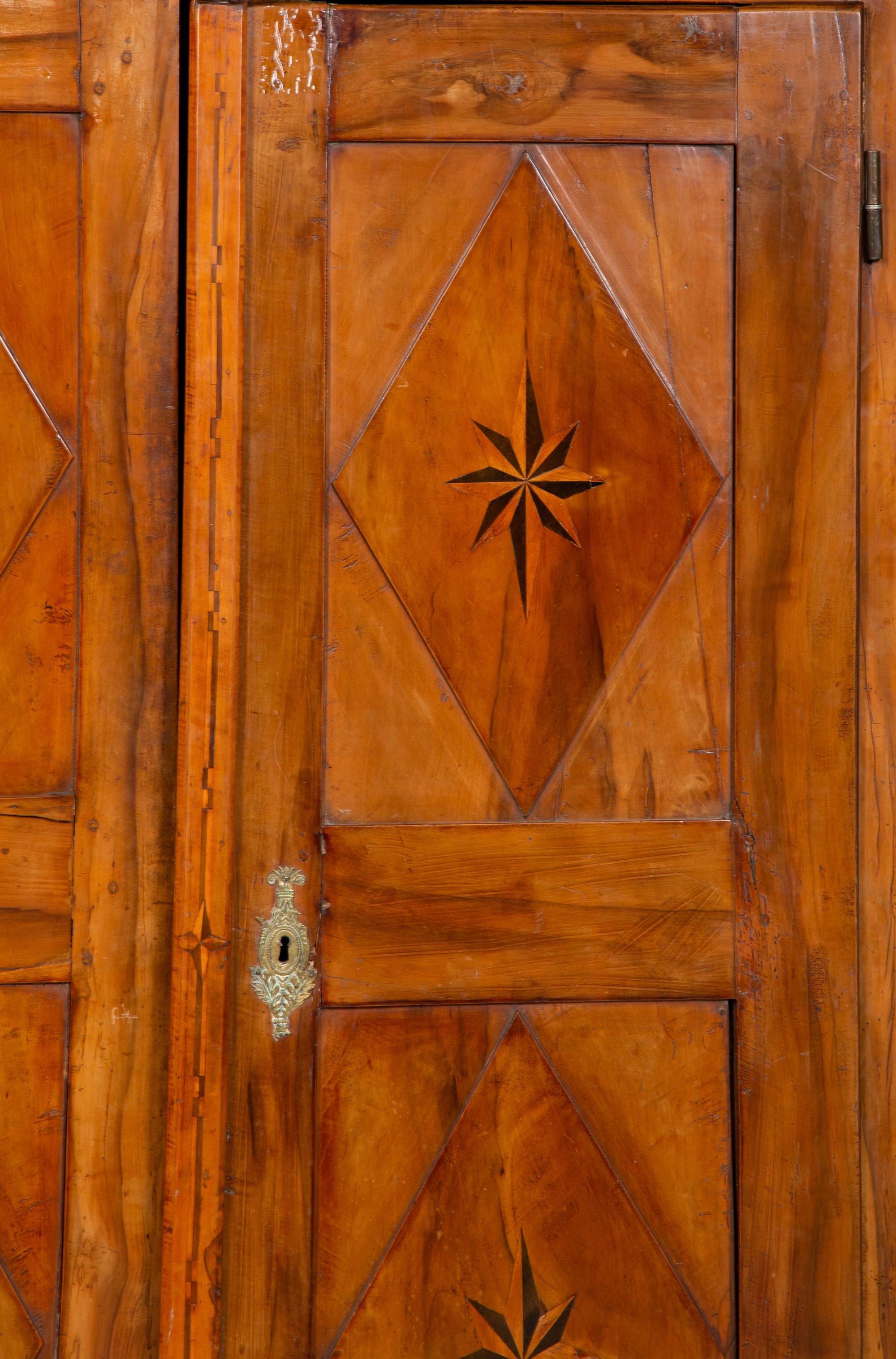 A Continental Olivewood Armoire