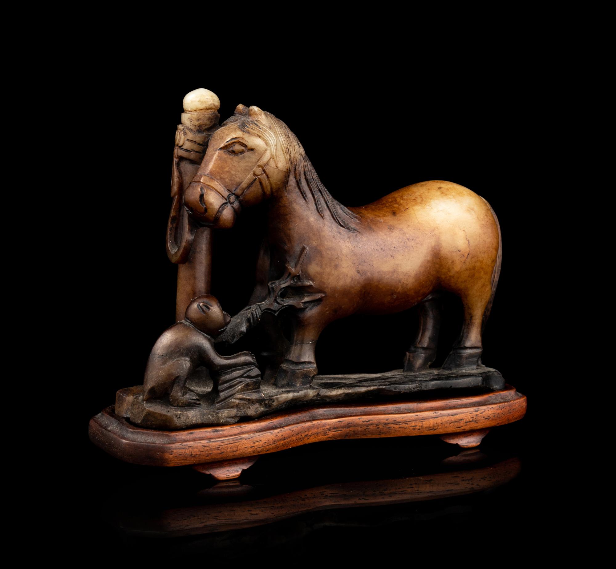 A Carved Russet Jade Figural Group of a Monkey and a Horse