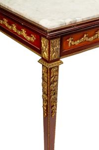 A Louis XVI Style Gilt Bronze Mounted Mahogany Marble-Top Center Table