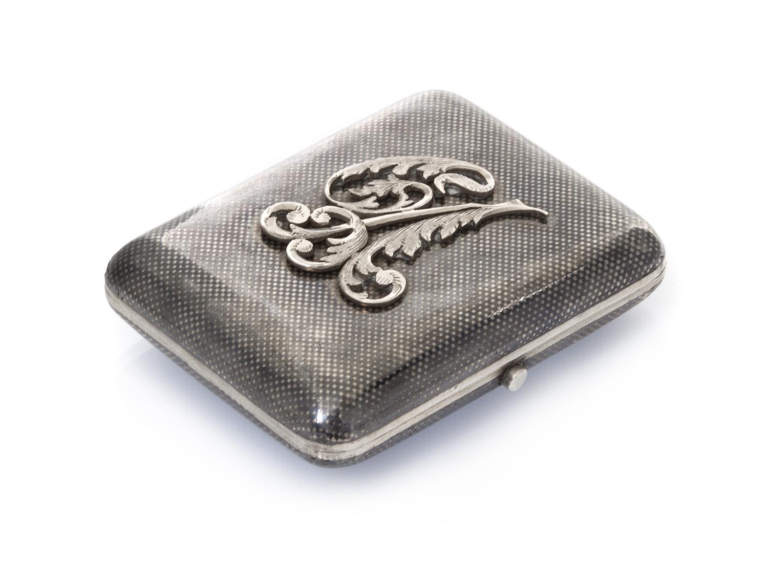 A Russian Niello Silver Cigarette Case, Mark likely of Gustav Klingert, Moscow, late 19th/early 20th century, the lid with an applied m