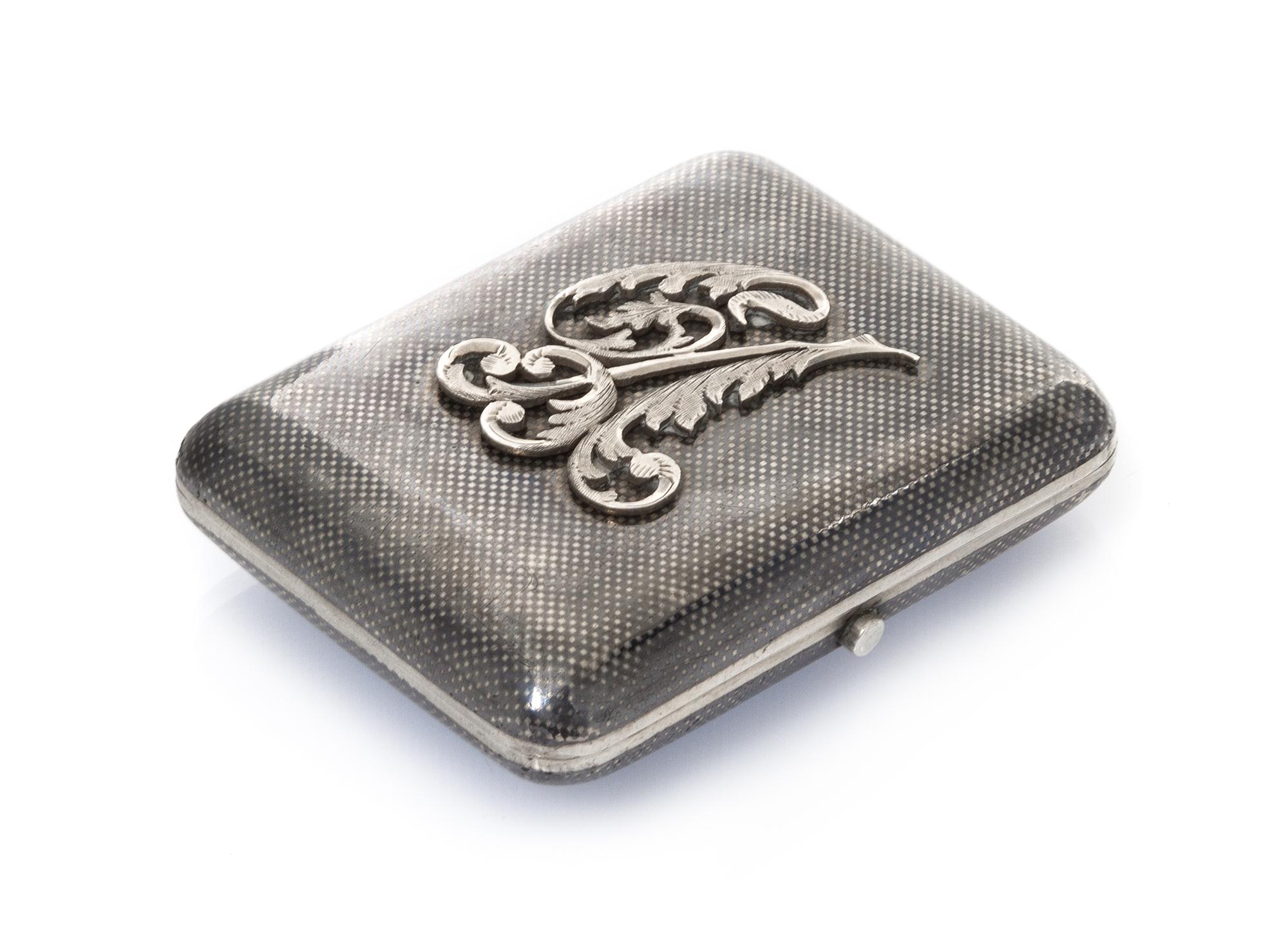 A Russian Niello Silver Cigarette Case, Mark likely of Gustav Klingert, Moscow, late 19th/early 20th century, the lid with an applied m