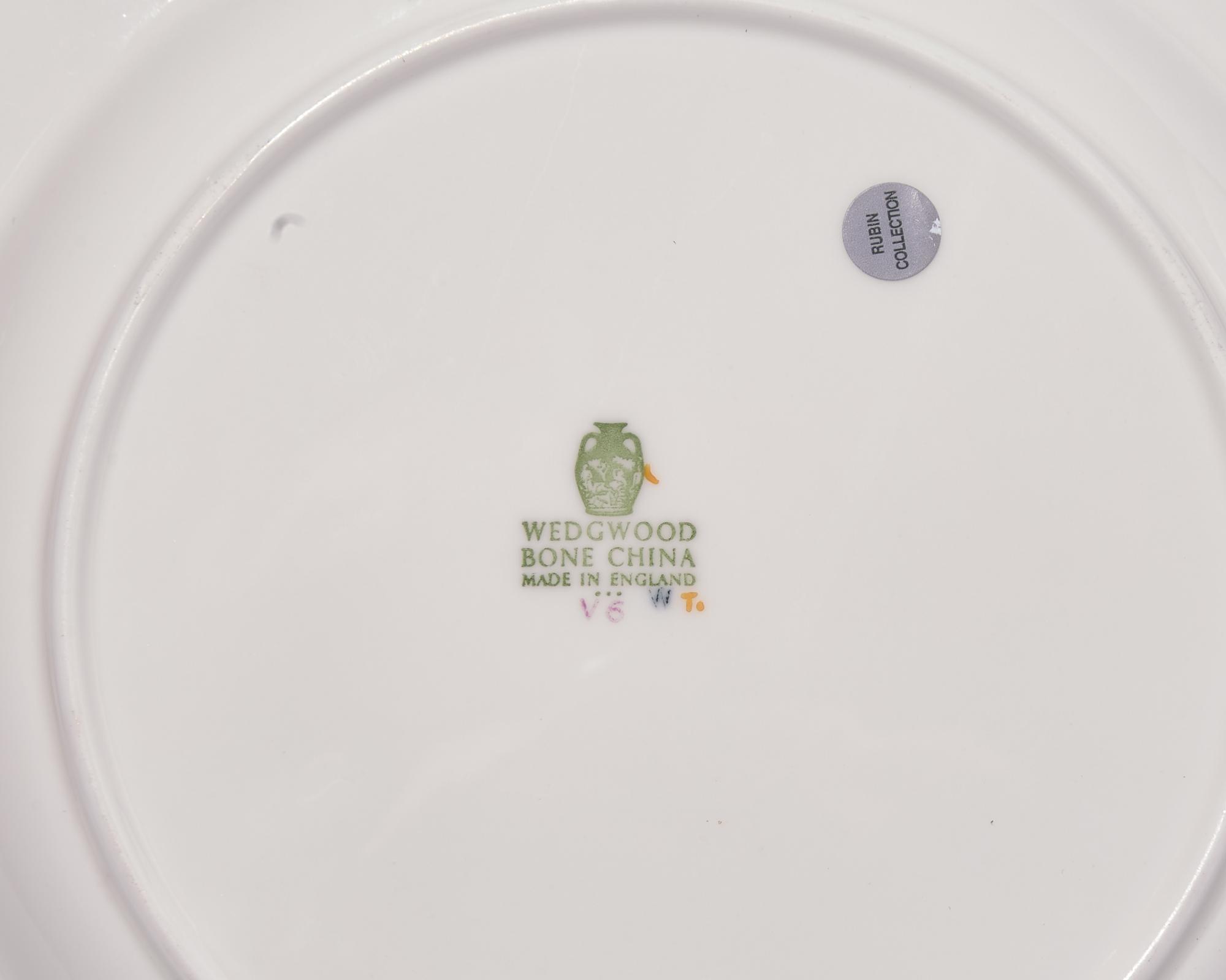 A Wedgwood Parcel Gilt Porcelain Dinner Service