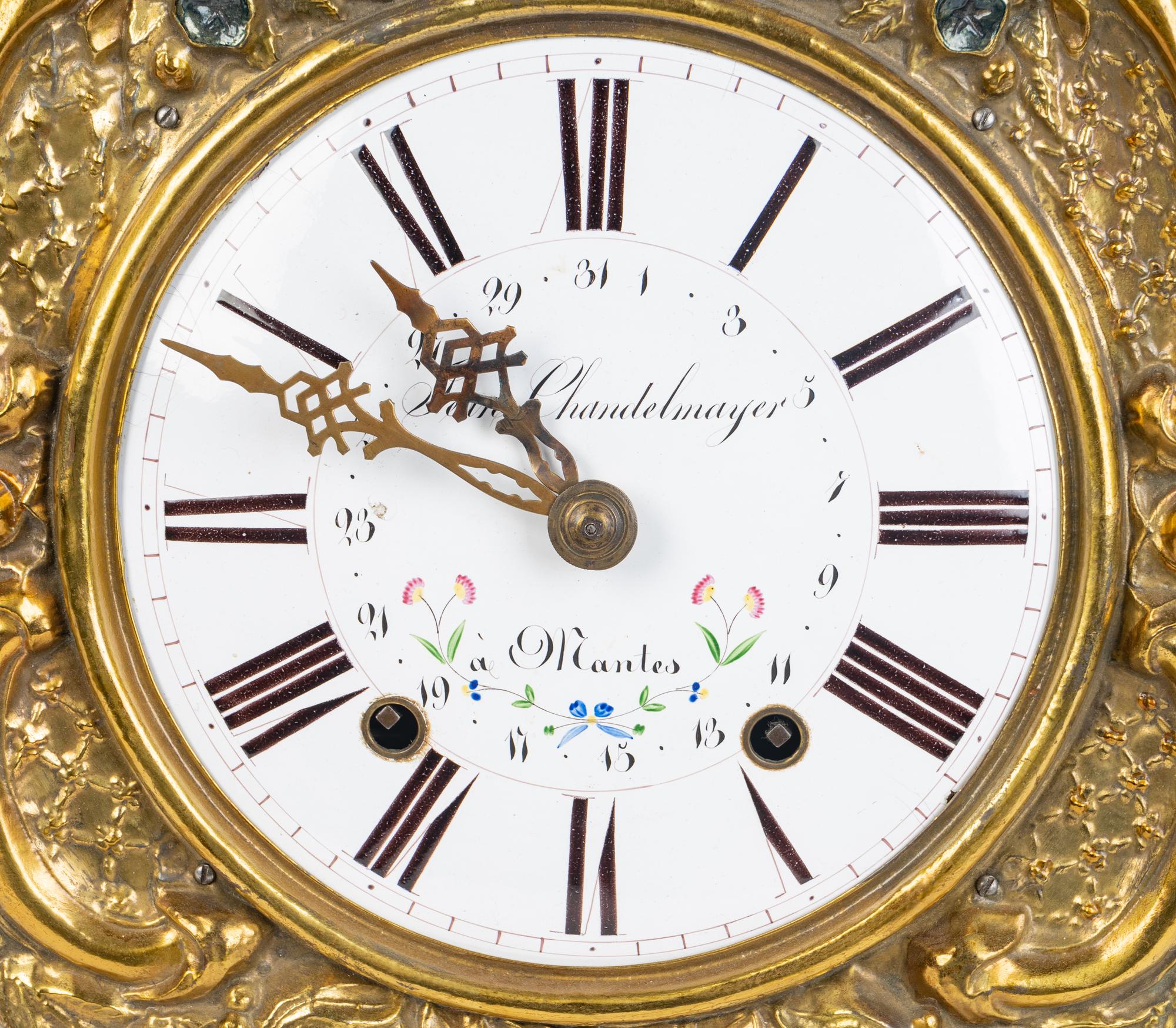 A French Repousséd Brass Comtoise Clock — 19TH CENTURY