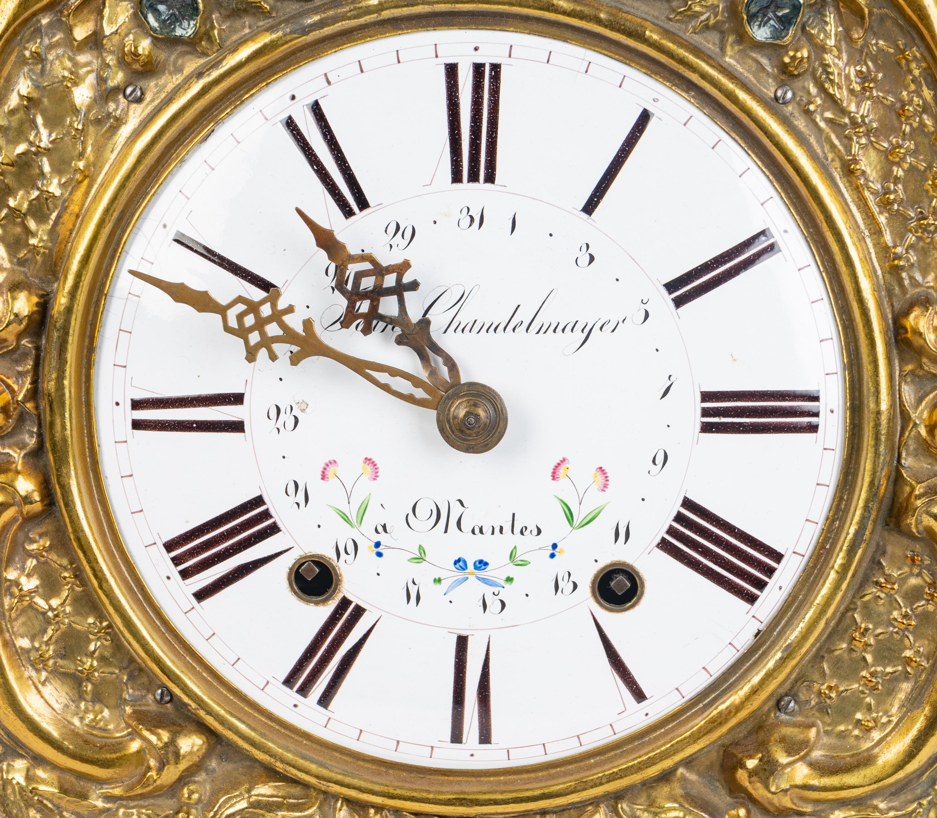 A French Repousséd Brass Comtoise Clock — 19TH CENTURY