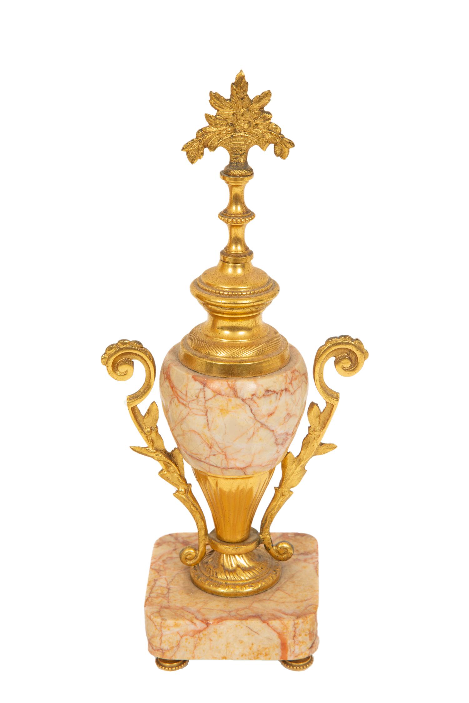 A French Gilt Bronze and Rouge Marble Clock Garniture