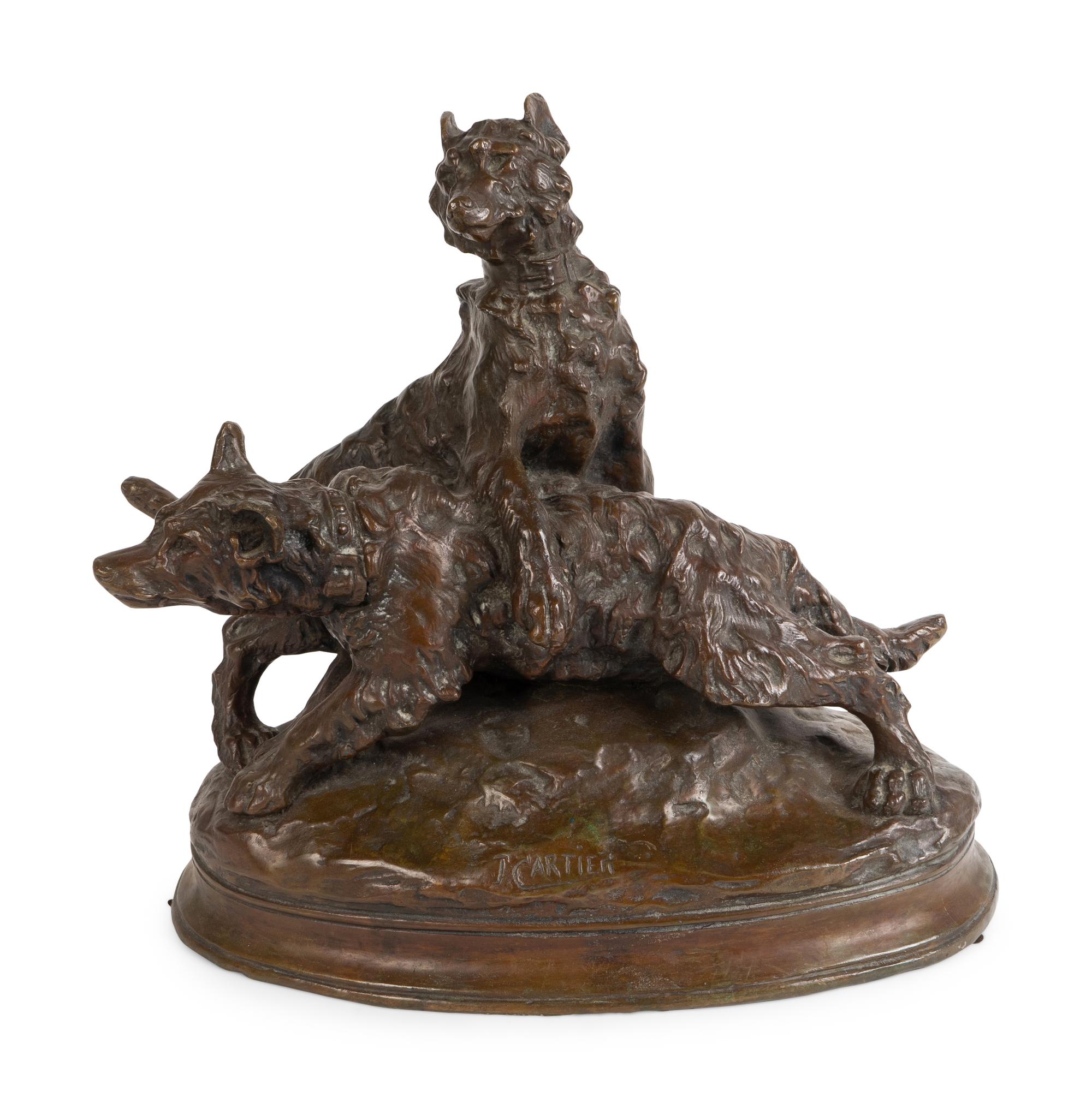 A French Patinated Bronze Group of Dogs — CAST AFTER A MODEL BY THOMAS FRANCOIS CARTIER (FRENCH, 1879-1943)