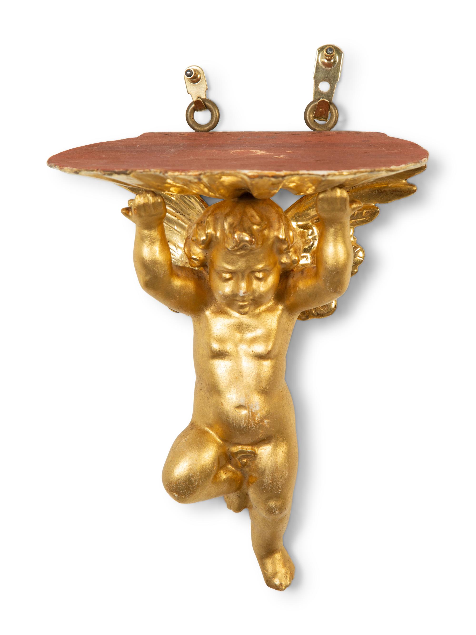 A Pair of Carved Giltwood Putti Wall Brackets