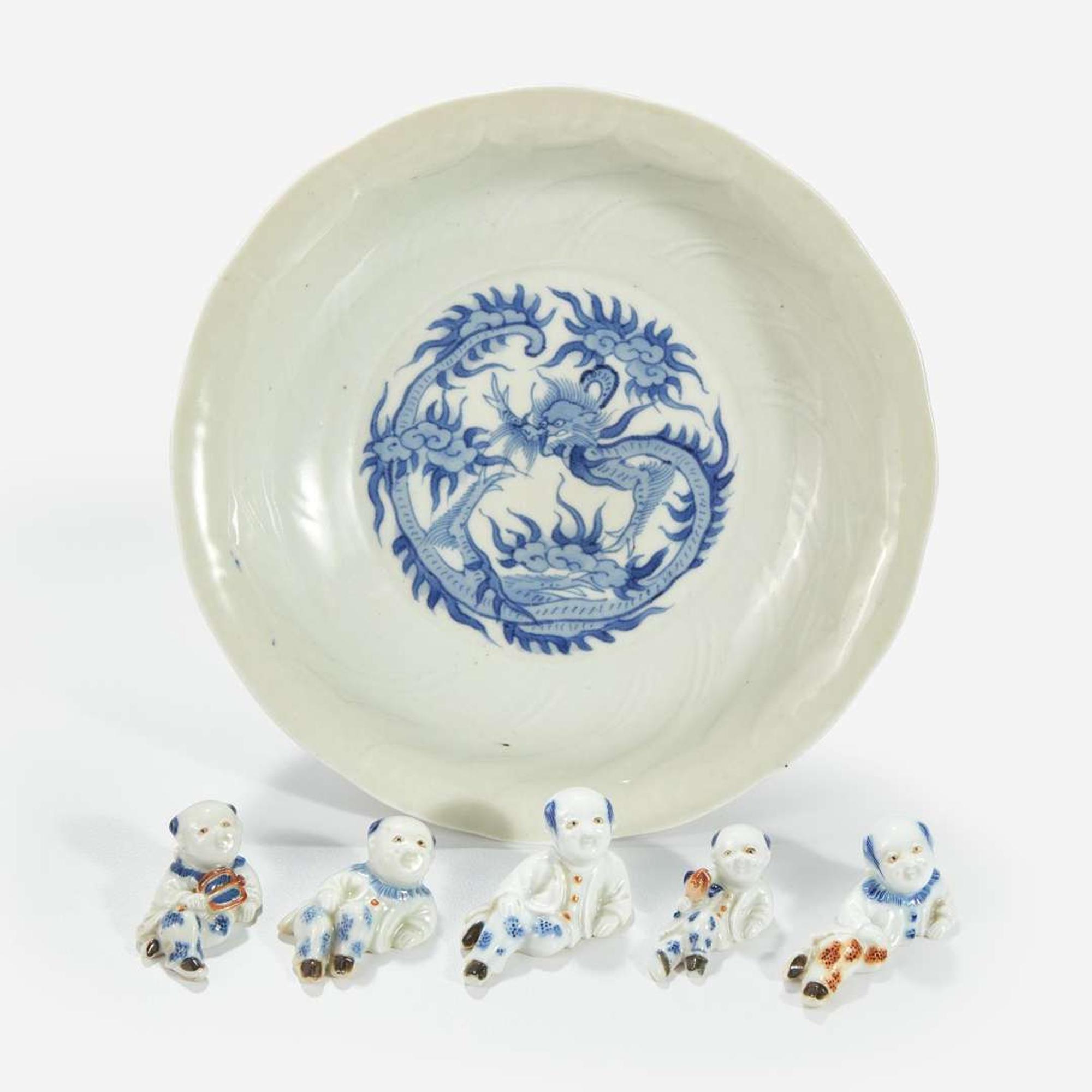 Five Hirado porcelain small figures of boys and a Nabeshima style molded “Dragon” dish 18th to 19th century