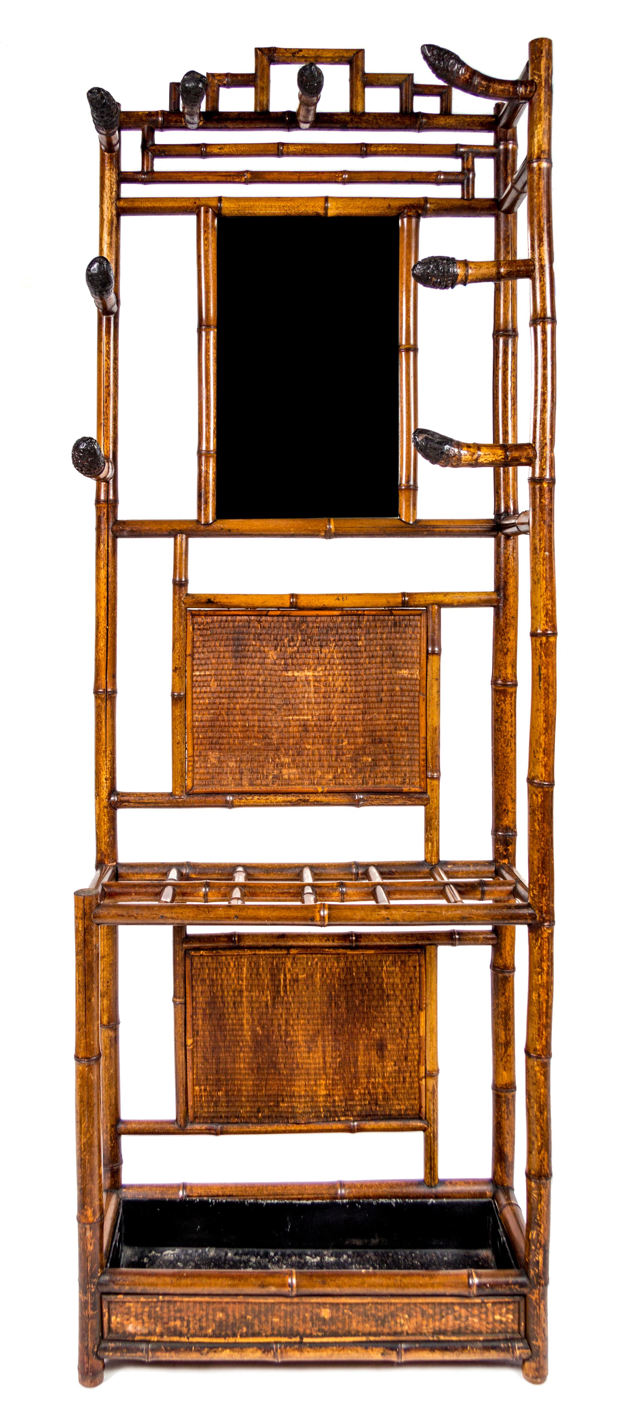A Bamboo and Rattan Hall Tree Height 78 x width 28 x depth 12 inches.