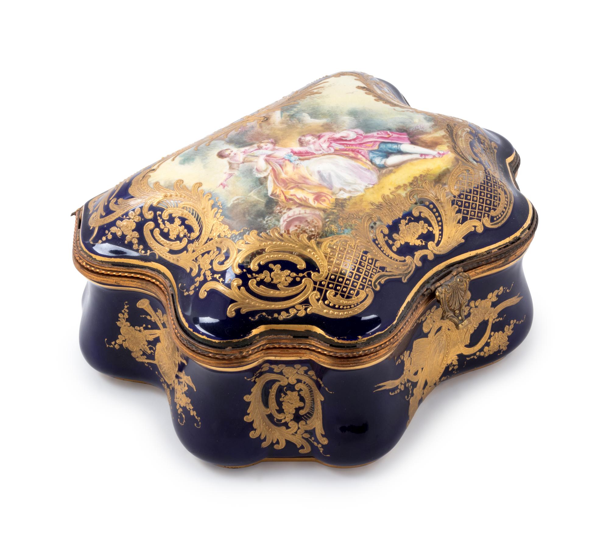 A Sèvres Style Painted and Parcel Gilt Porcelain Table Casket
