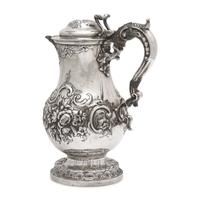 A Belgian Repoussé Silver Ewer