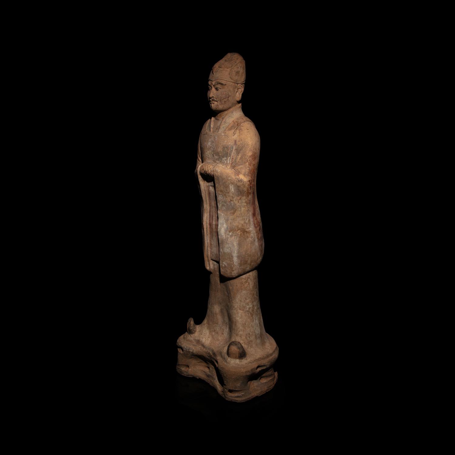 A Chinese Painted Pottery Standing Official, Tang Dynasty — 唐 陶加彩文官俑