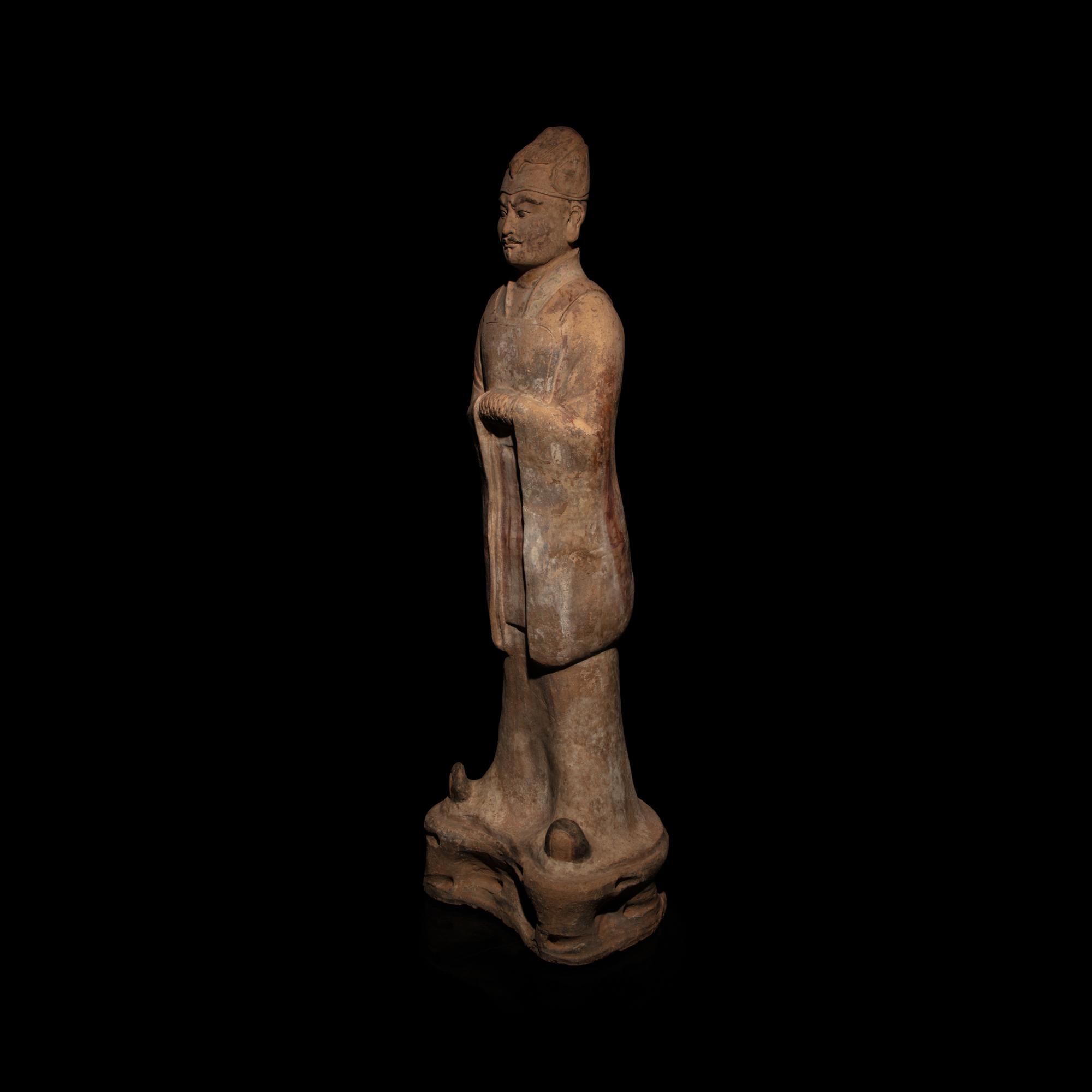 A Chinese Painted Pottery Standing Official, Tang Dynasty — 唐 陶加彩文官俑