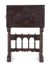 A Spanish Iron Mounted Carved Walnut Vargueño on Stand