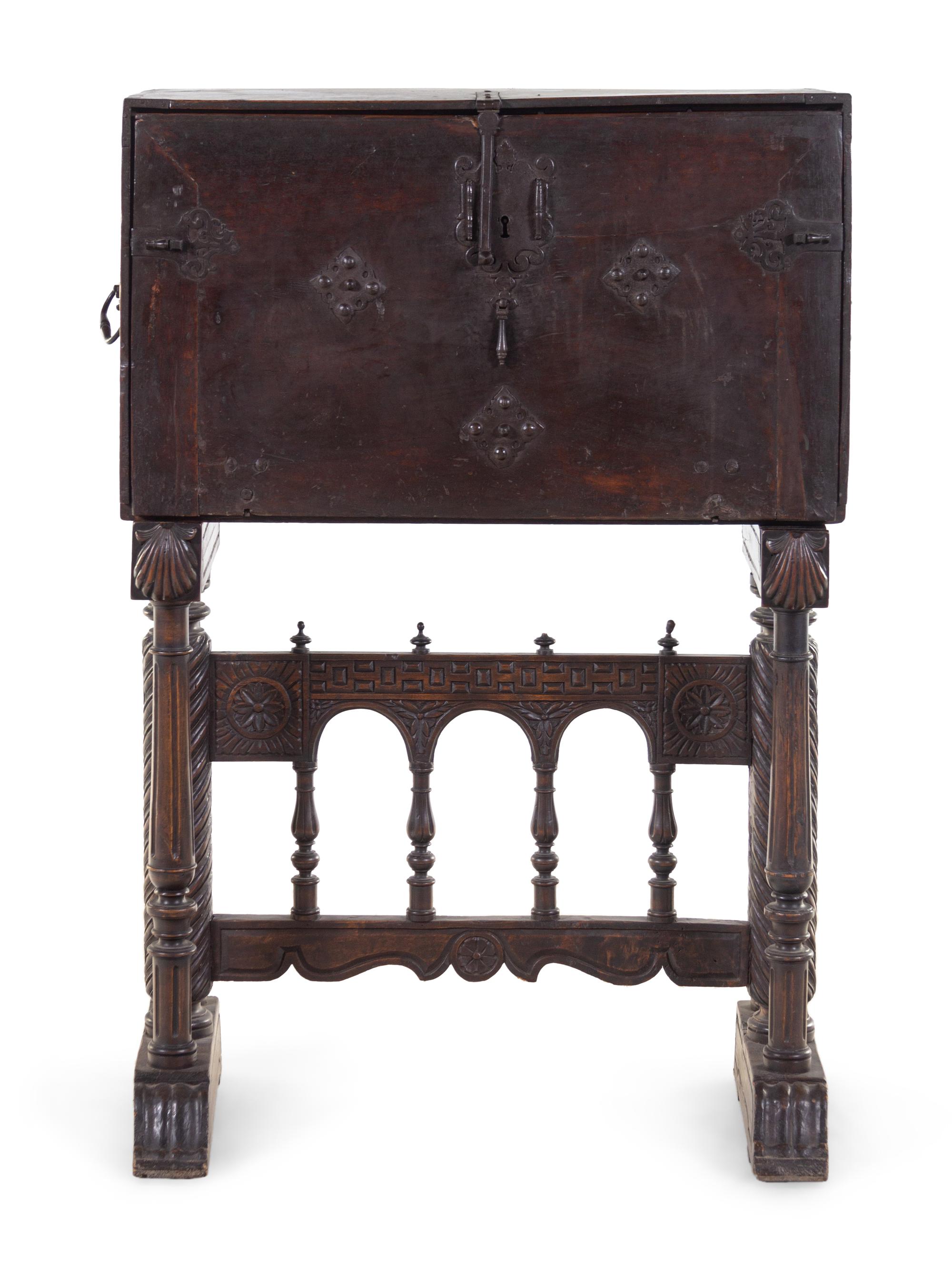 A Spanish Iron Mounted Carved Walnut Vargueño on Stand