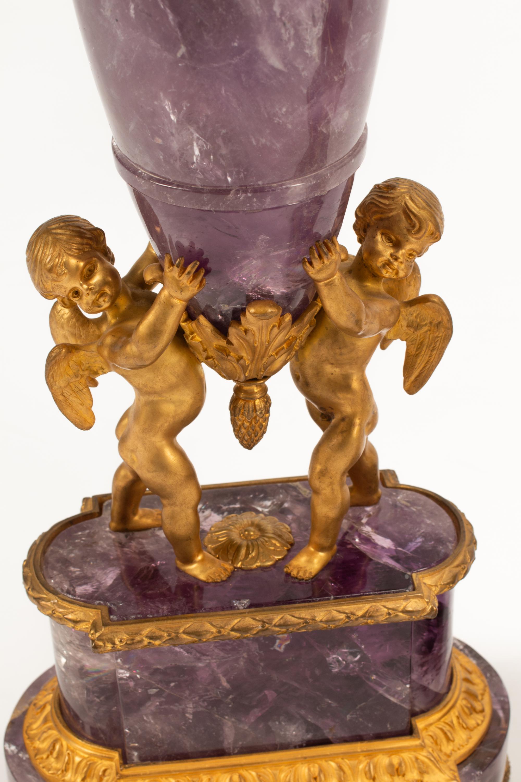A Pair of French Gilt Bronze and Amethyst Figural Urns