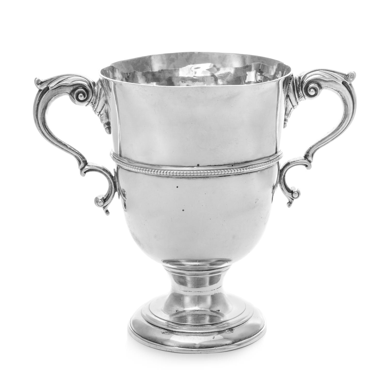 An Irish George III Silver Loving Cup, Likely J. Locker, Dublin, 1761, having acanthus-topped S-scoll handles, the body decorated with
