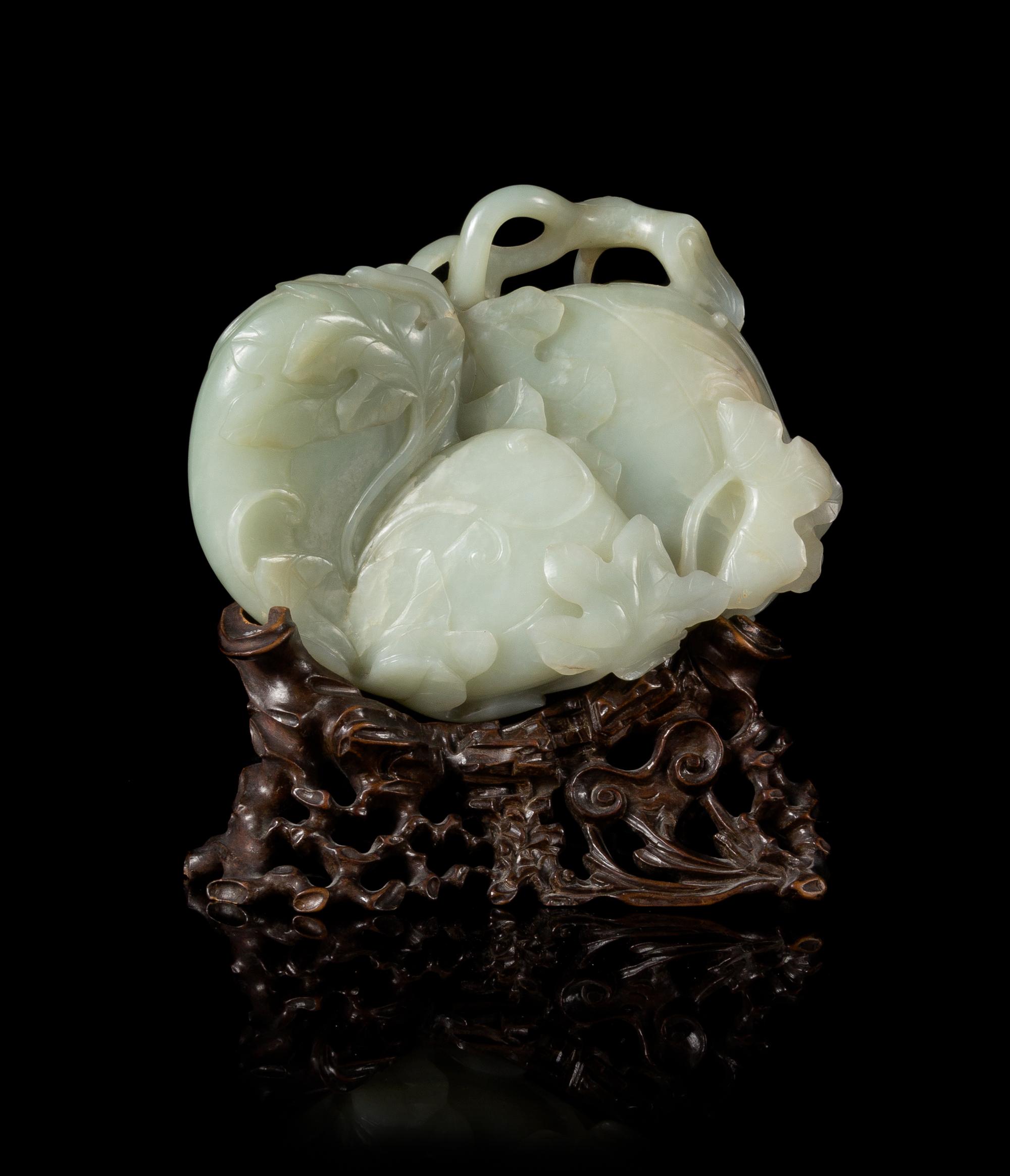A Finely Carved Pale Celadon Jade Melon Group Width 6 inches. — 18TH CENTURY