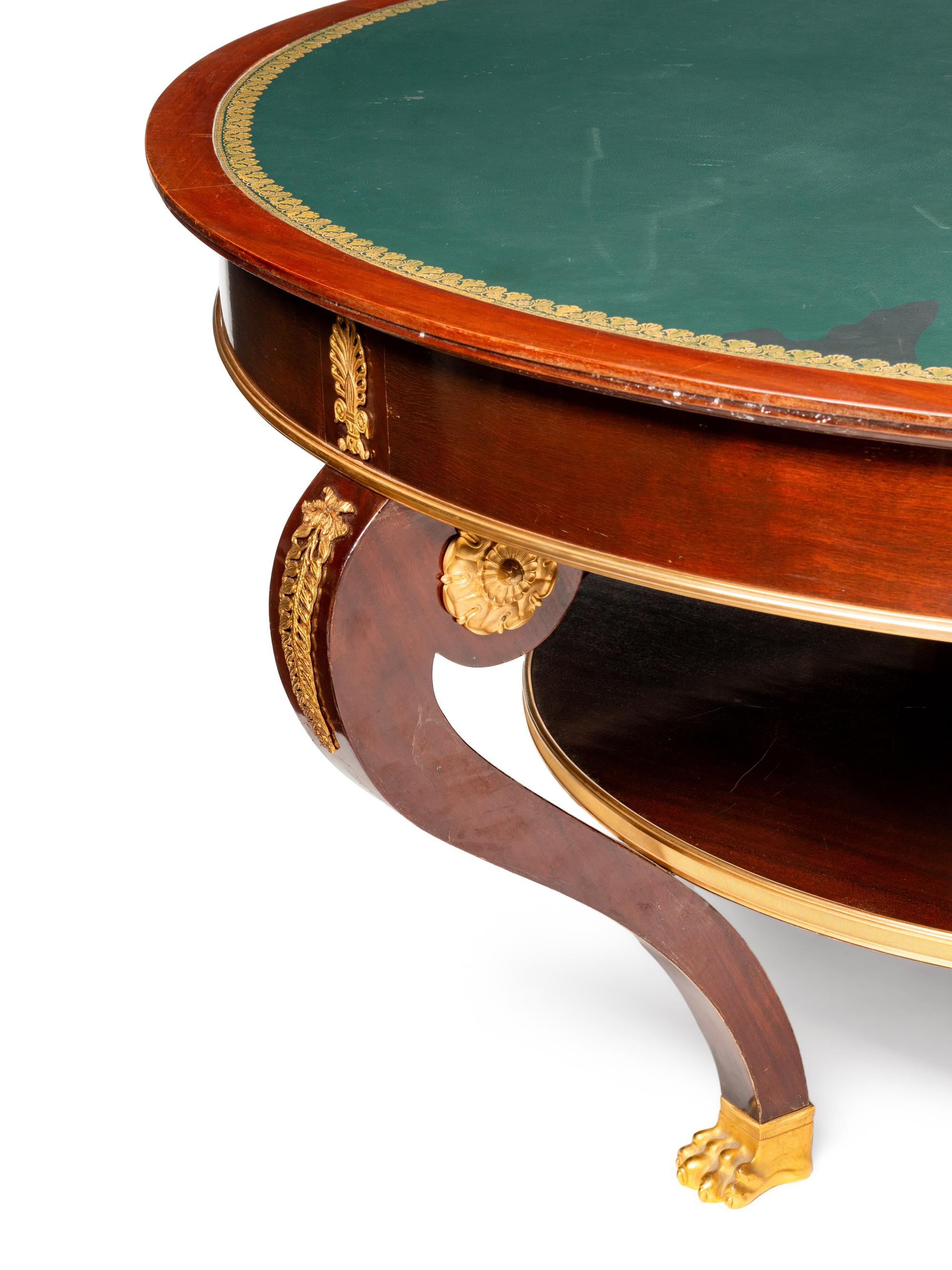An Empire Style Gilt Bronze Mounted Mahogany Leather-Top Center Table