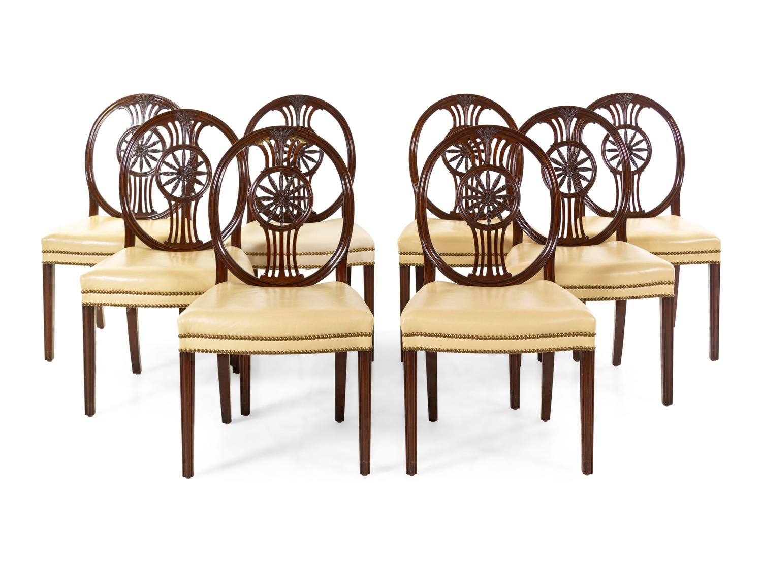 A Set of Eight Regency Style Carved Mahogany Leather-Upholstered Dining Chairs